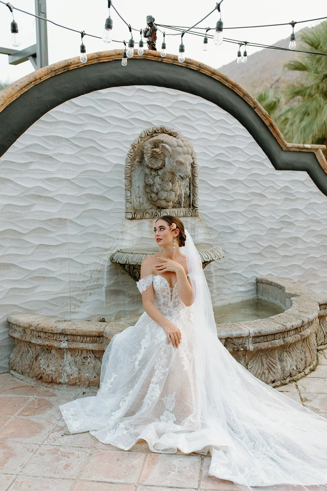 Bride framed by venue architecture during portrait.