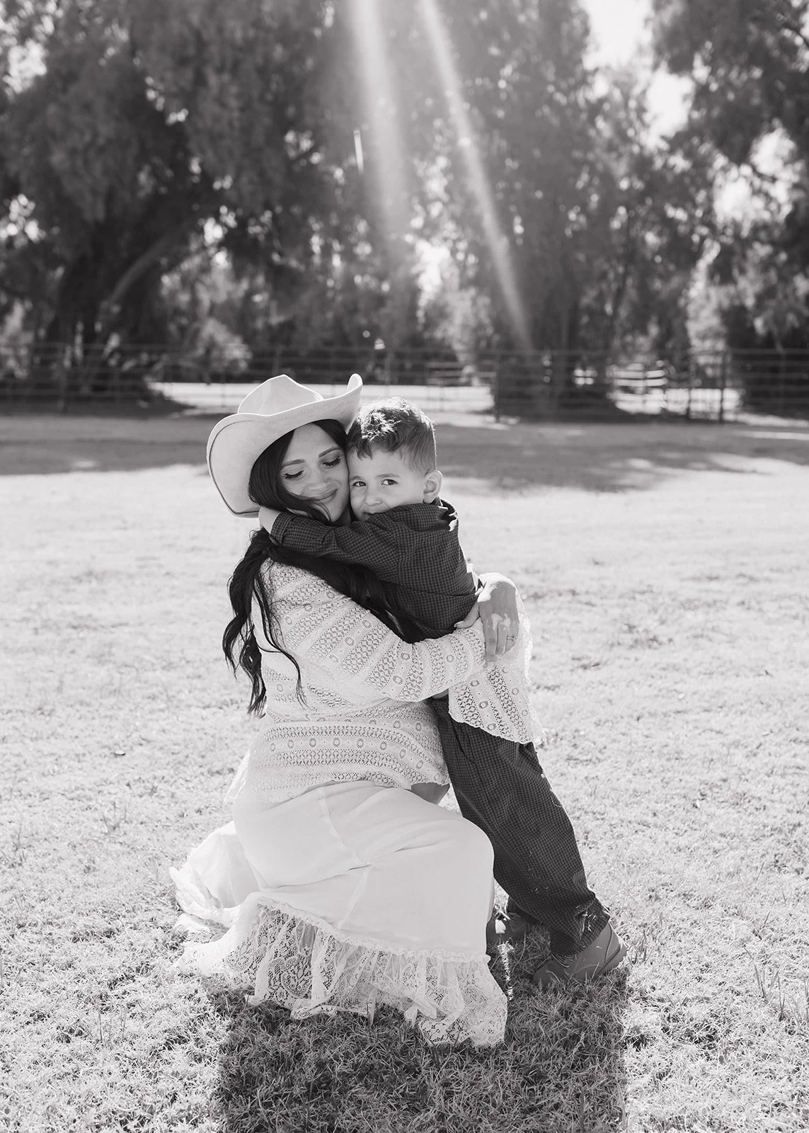 Maternity portrait captured in warm golden hour light.