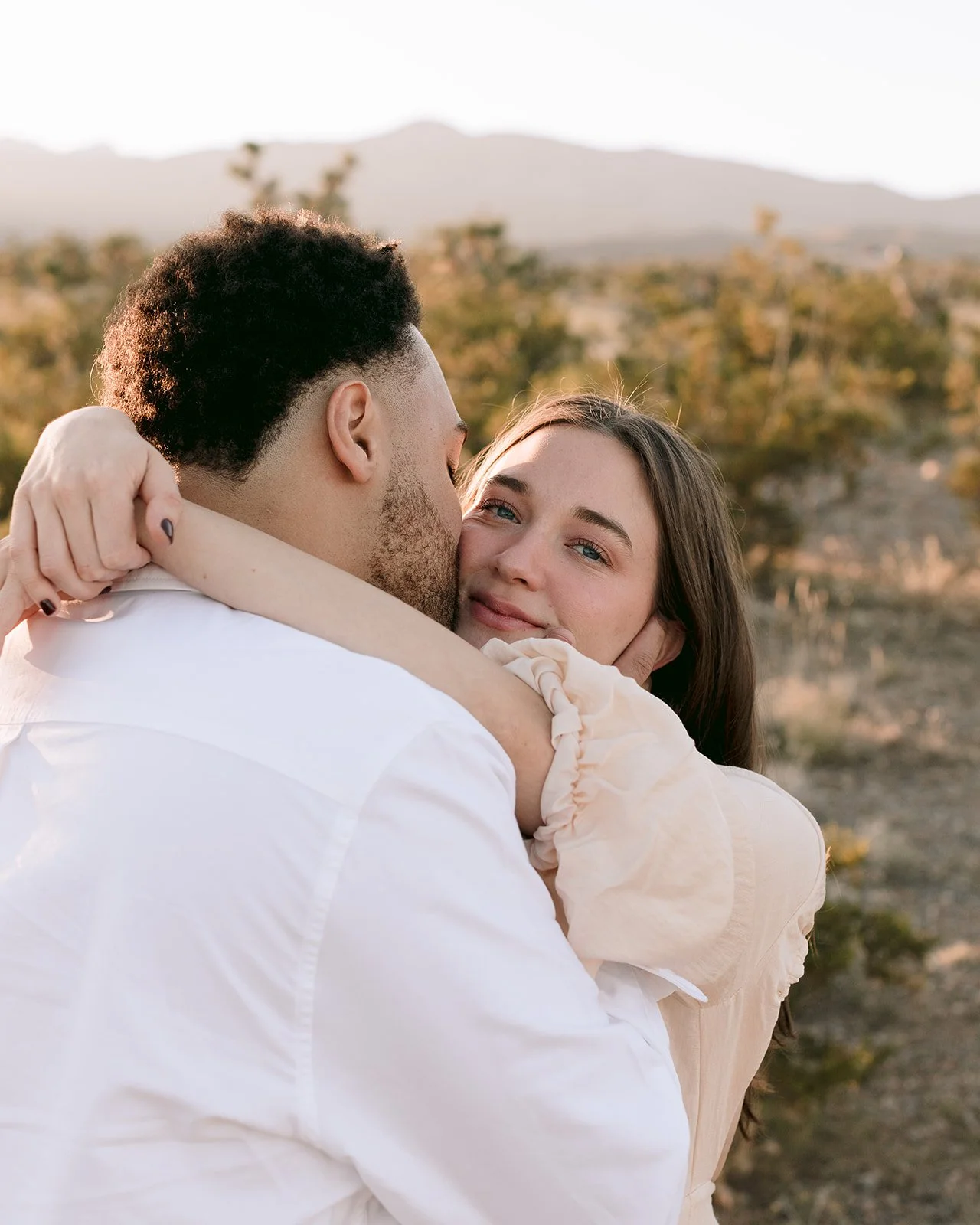 Close-up portrait of couple sharing intimate moment.