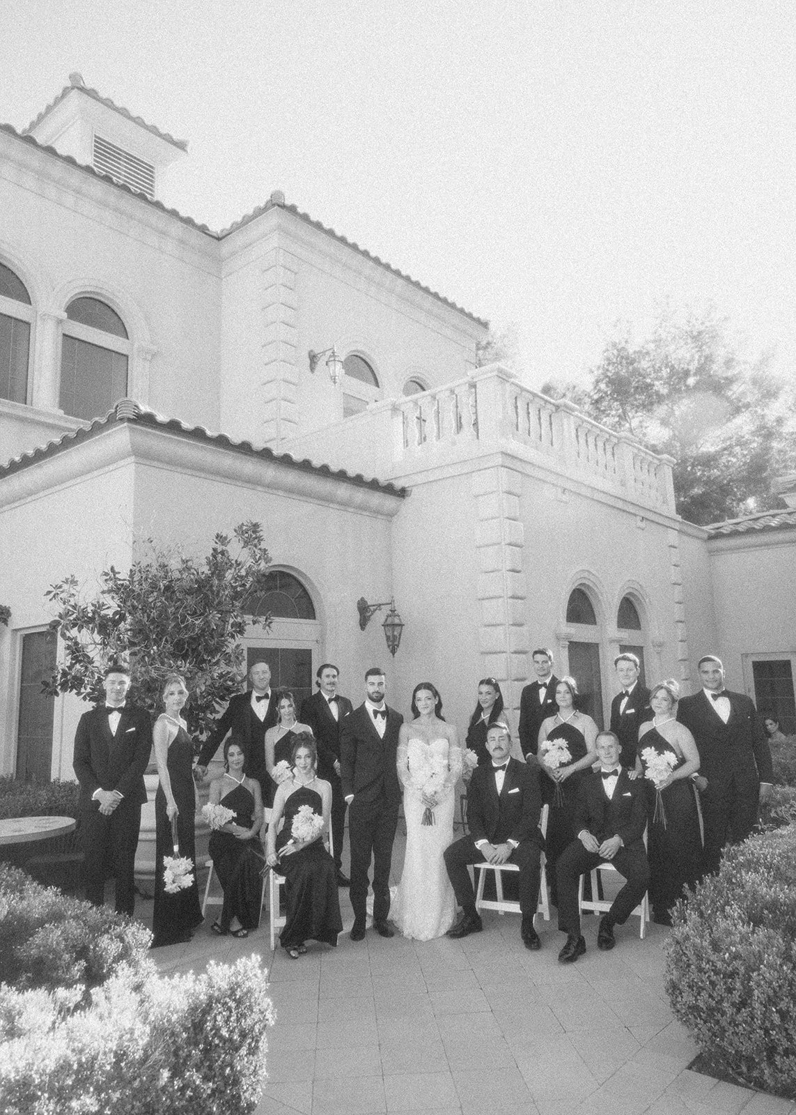 Elegant wedding party portrait at garden themed wedding.