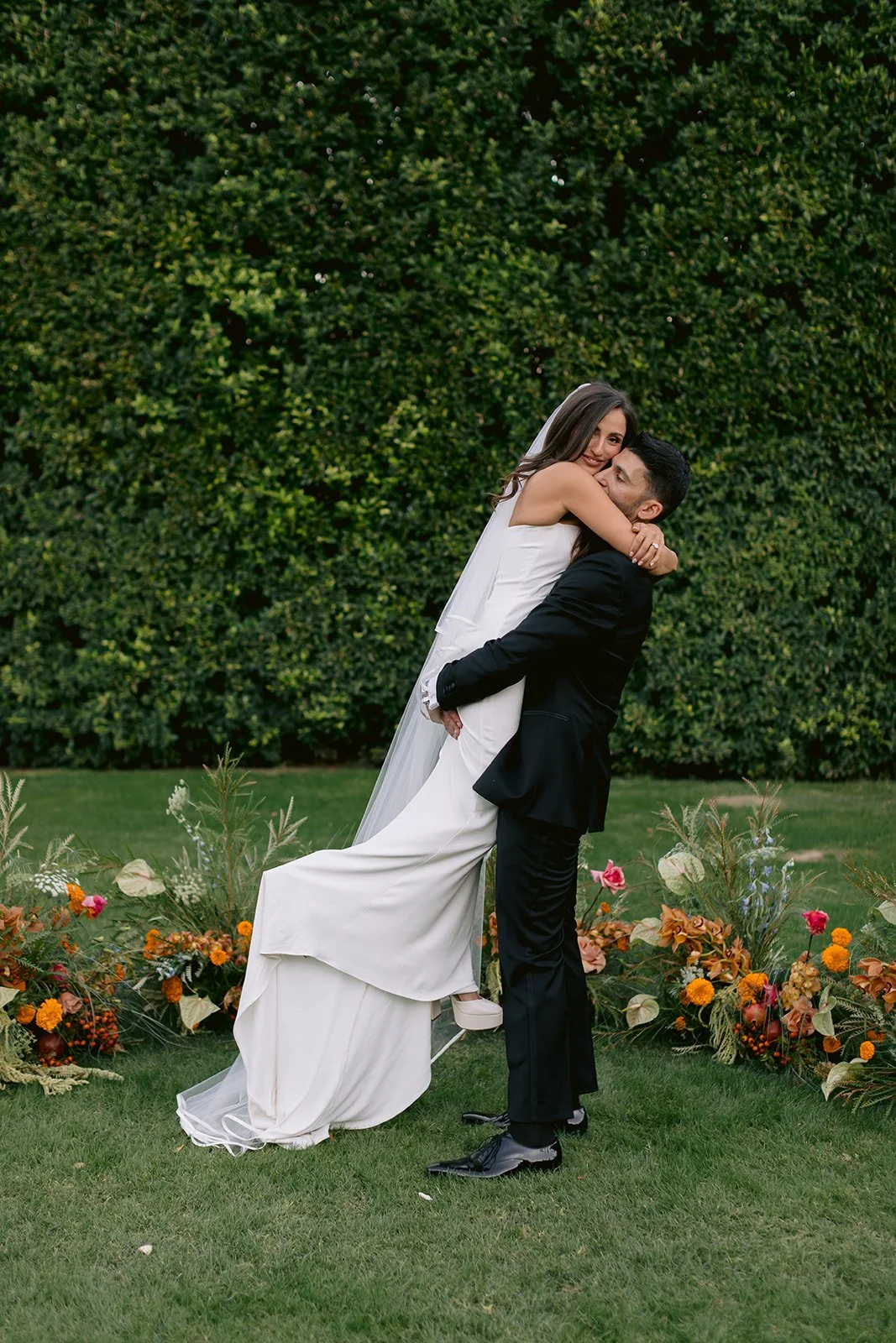 Editorial wedding couple portrait in natural light.
