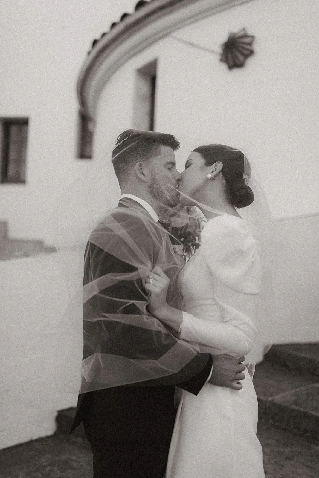 Soft, romantic portrait of the couple captured in a serene, balanced composition.