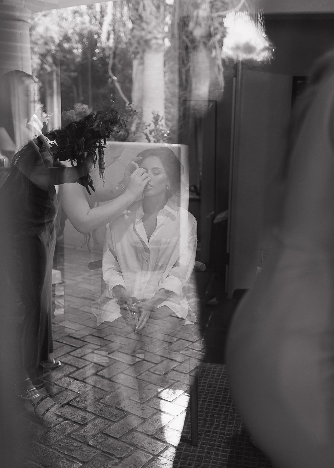 Unique perspective of bride getting her makeup done.