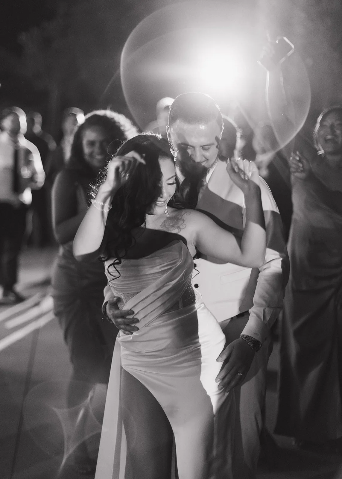 Bride and groom sharing dance on the reception dance floor.