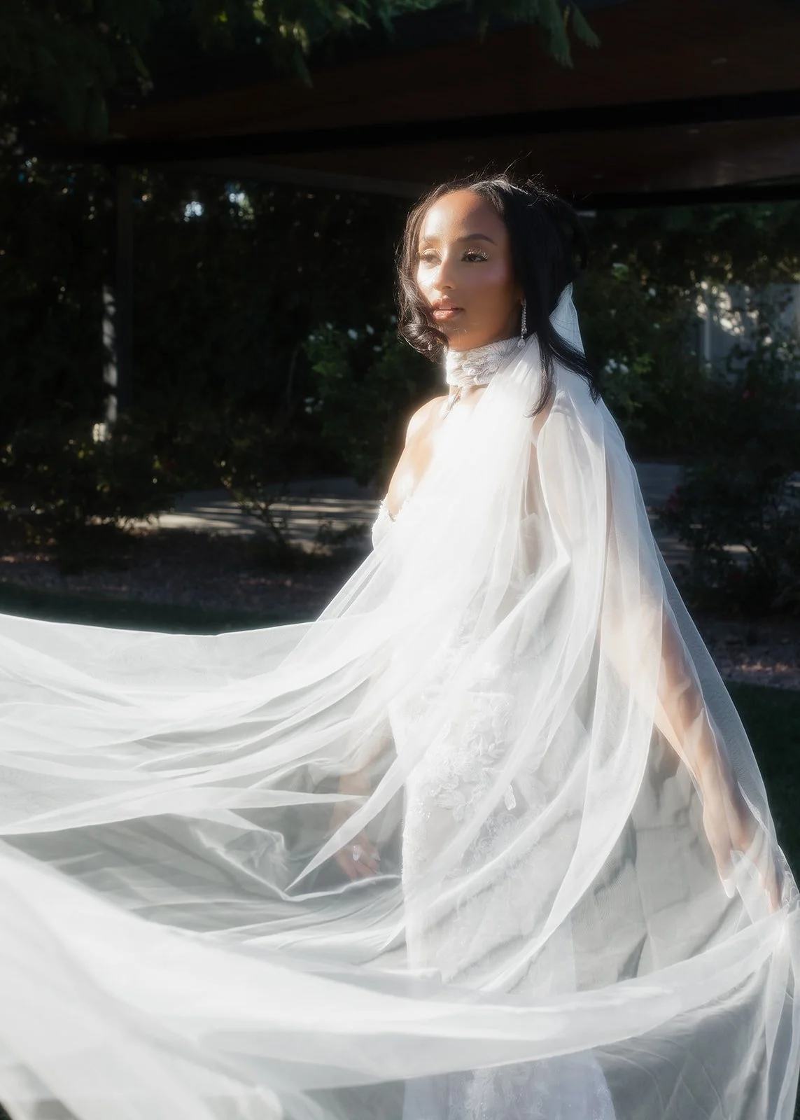 Ethereal bride portrait with modern posing and golden hour light.