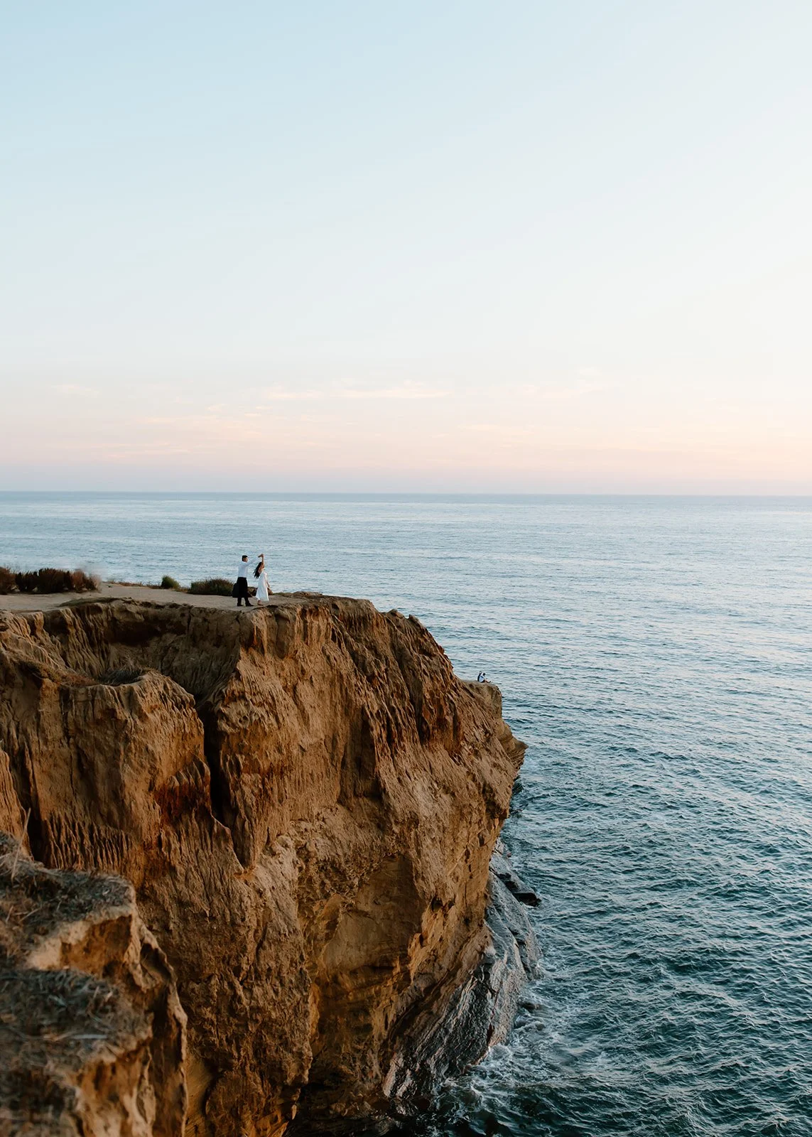Beachside engagement shoot at golden hour.