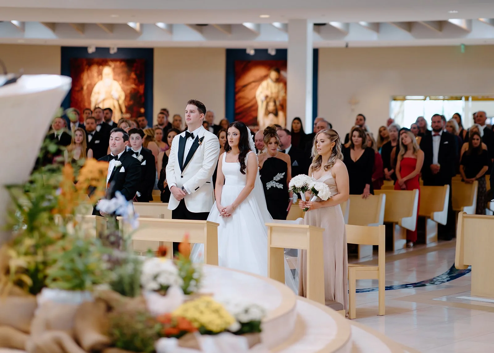 The bride & groom share an emotional moment at the altar.