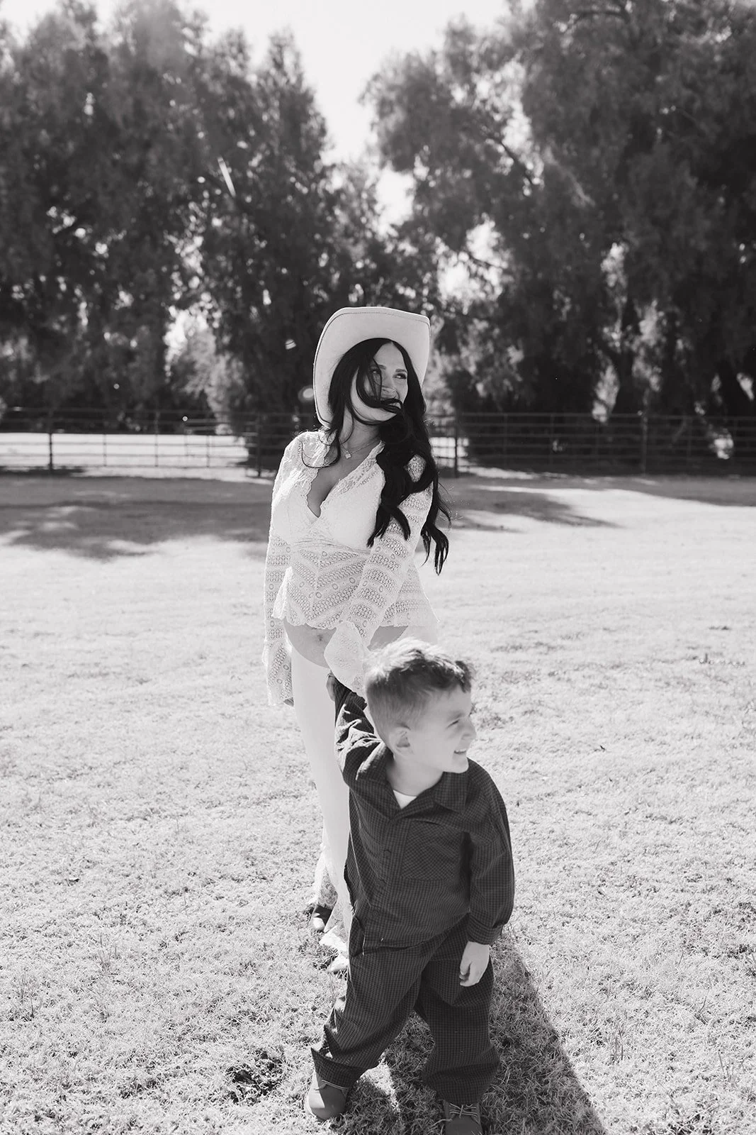 Mommy and son pose for family photos.