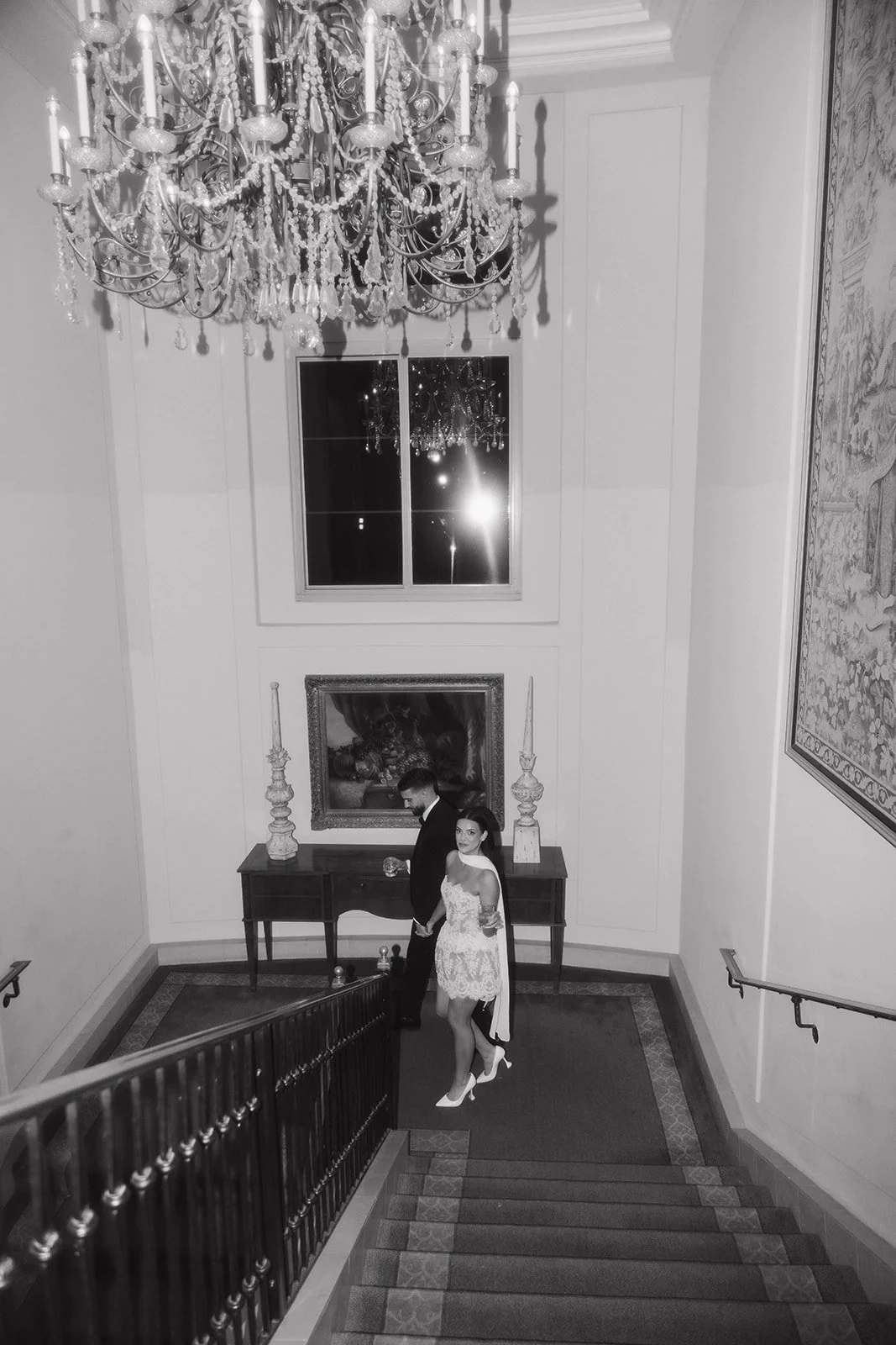 Structured editorial portrait at elegant reception.