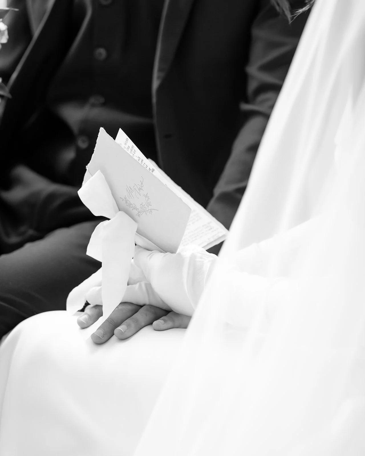 Detail shot of bride's vow book.