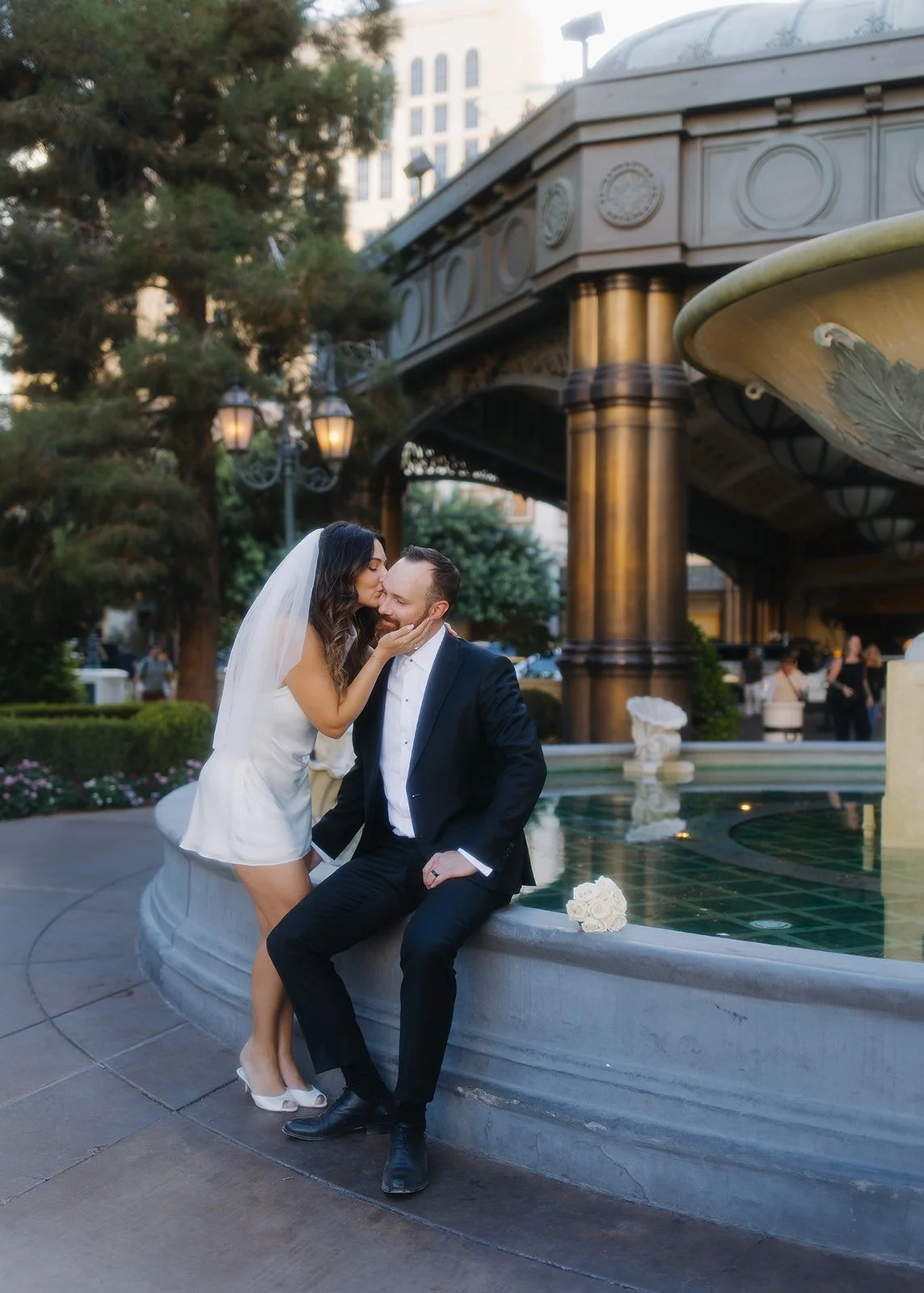 Elegant couple portrait with composed styling in natural light.