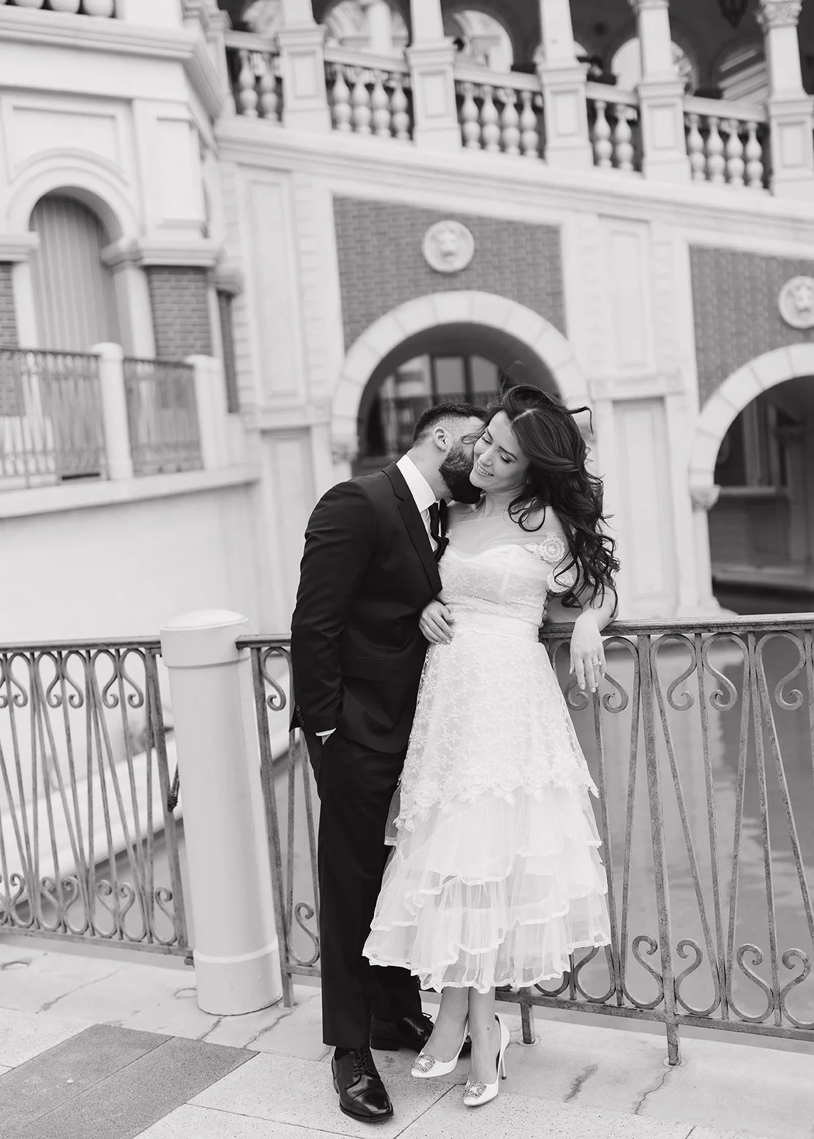 Couple posed together during modern engagement portrait session.