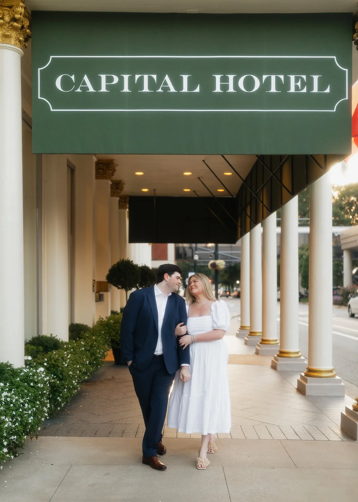 Editorial engagement portrait captured along city streets.