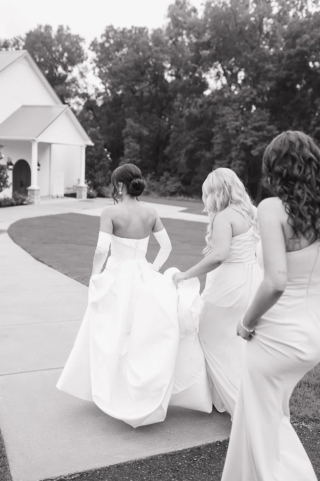 Editorial bridesmaid moment with refined styling and natural laughter.