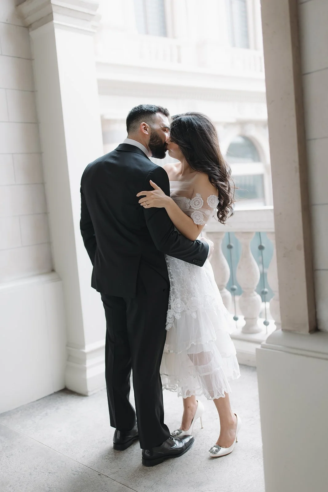 Intimate portrait of couple embracing during engagement session.
