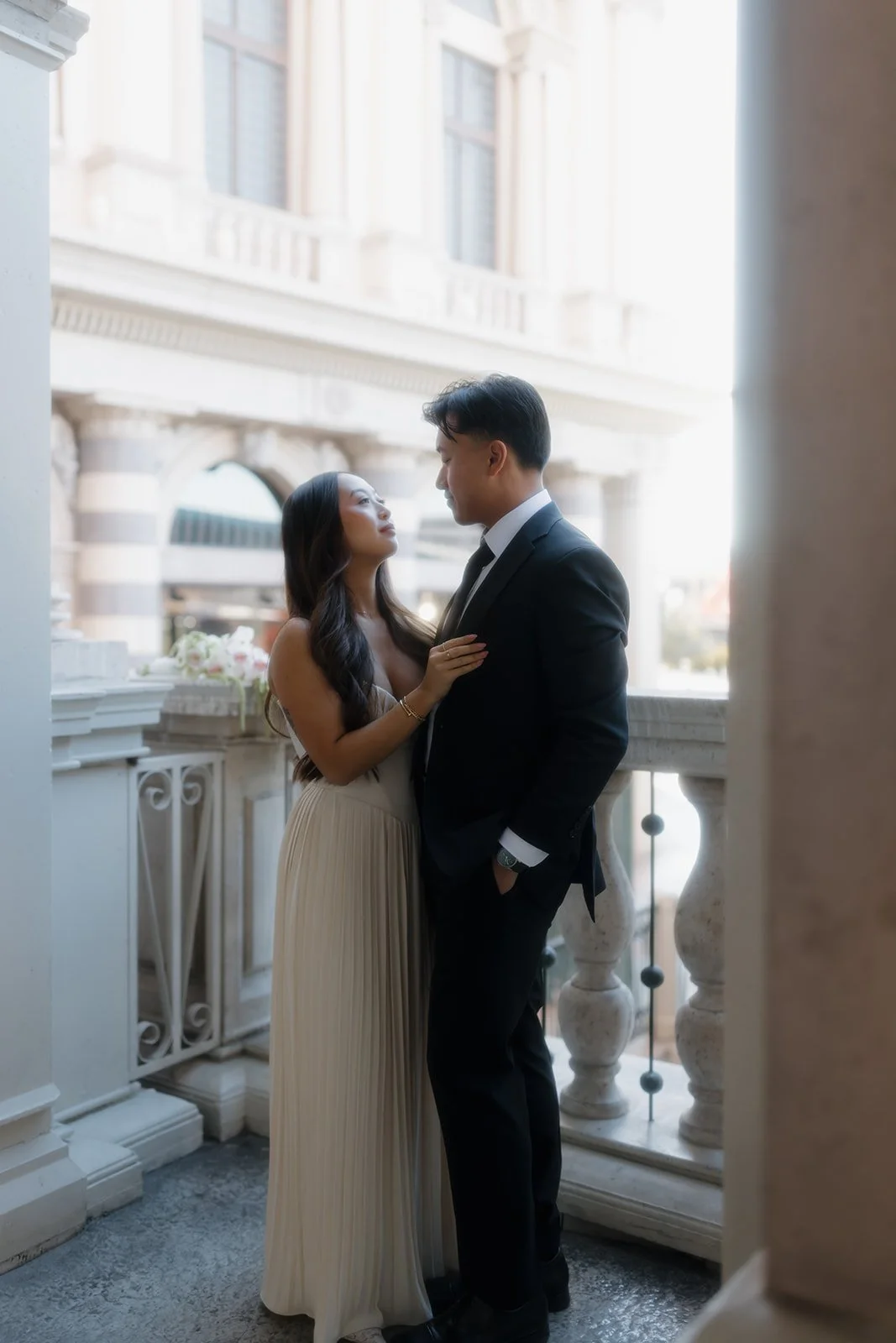 Intimate moment between couple during engagement photoshoot.
