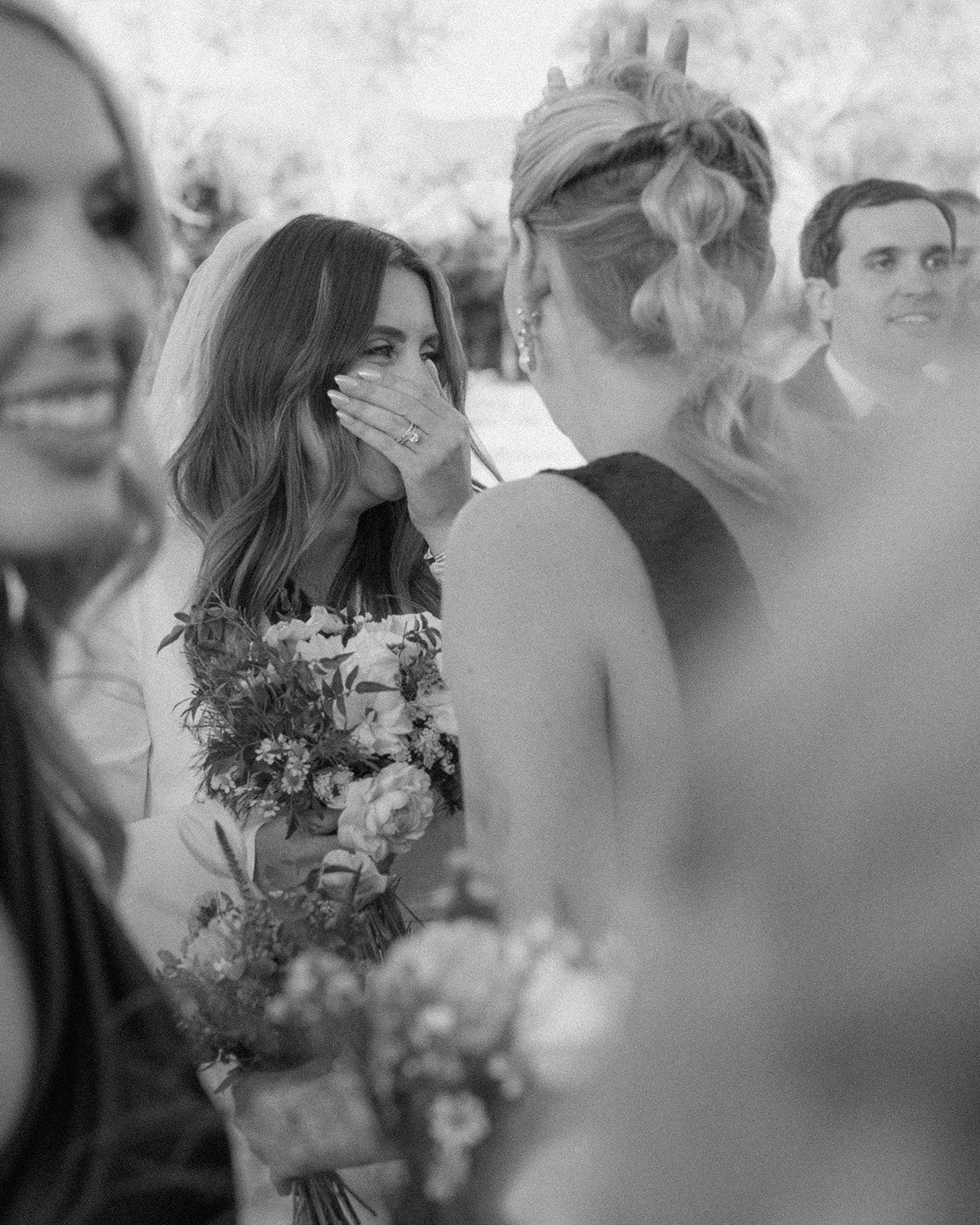 Candid moment of joyful bride right after her ceremony.