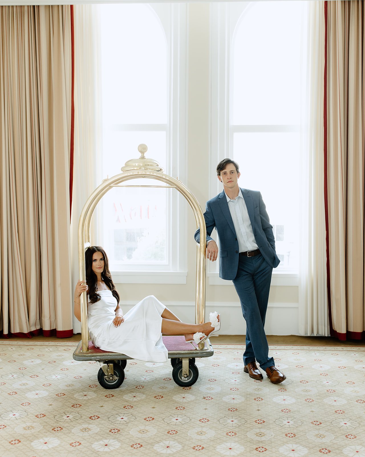 Modern engagement portrait with composed and elegant styling.