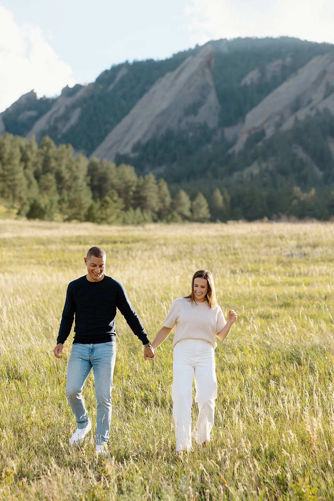 Outdoor kiss captured during sunset engagement portrait.