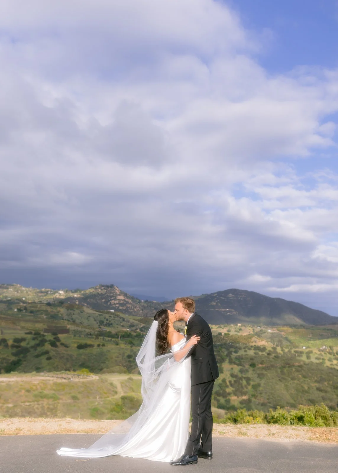 Editorial wedding portrait of the couple in soft, natural light.