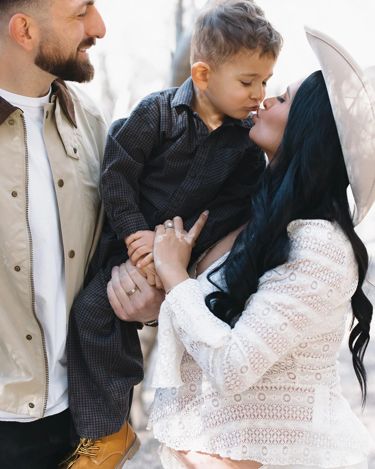 Modern family portrait with composed and refined positioning.