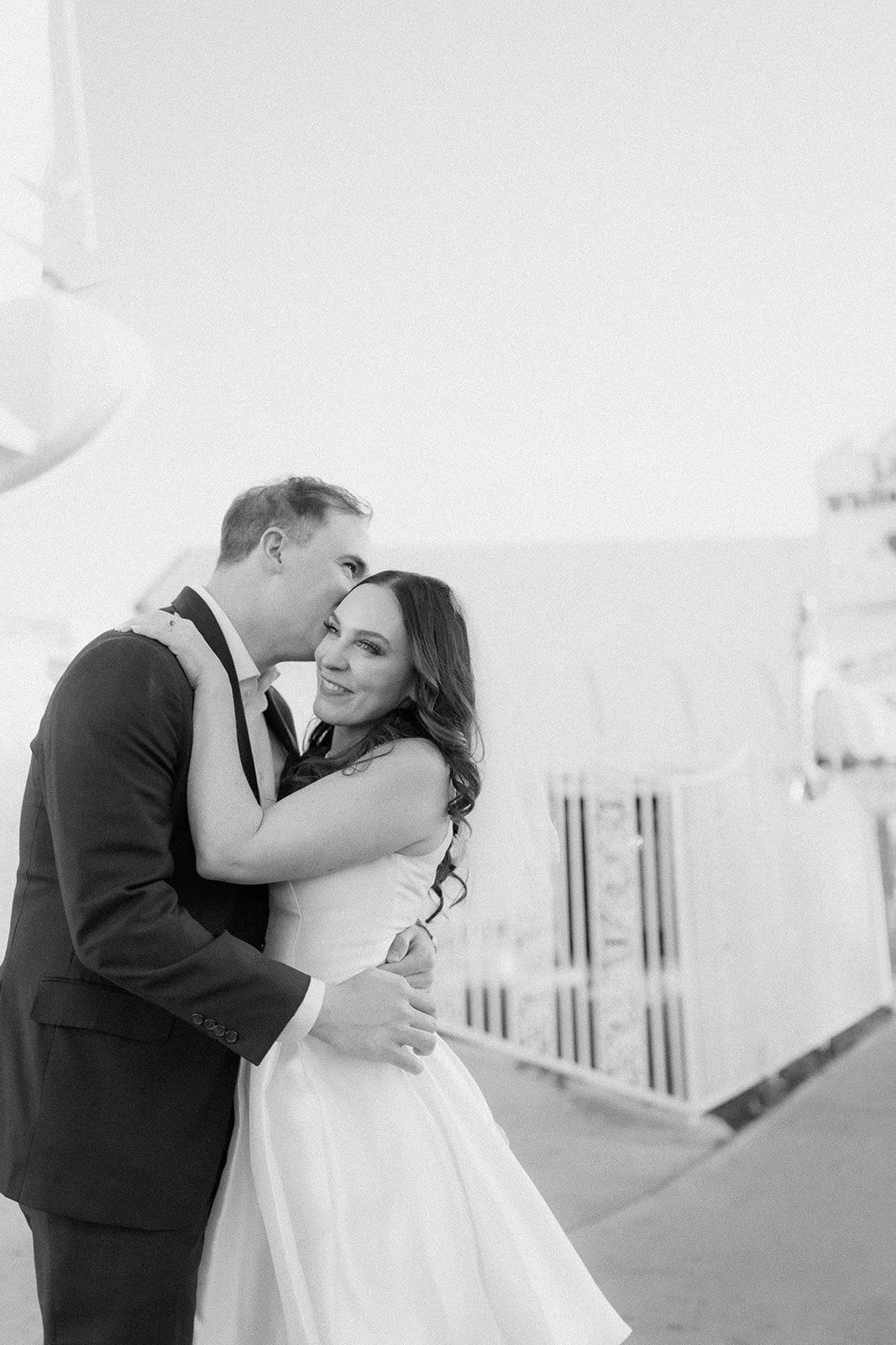 High-fashion engagement portrait with refined, intentional styling.