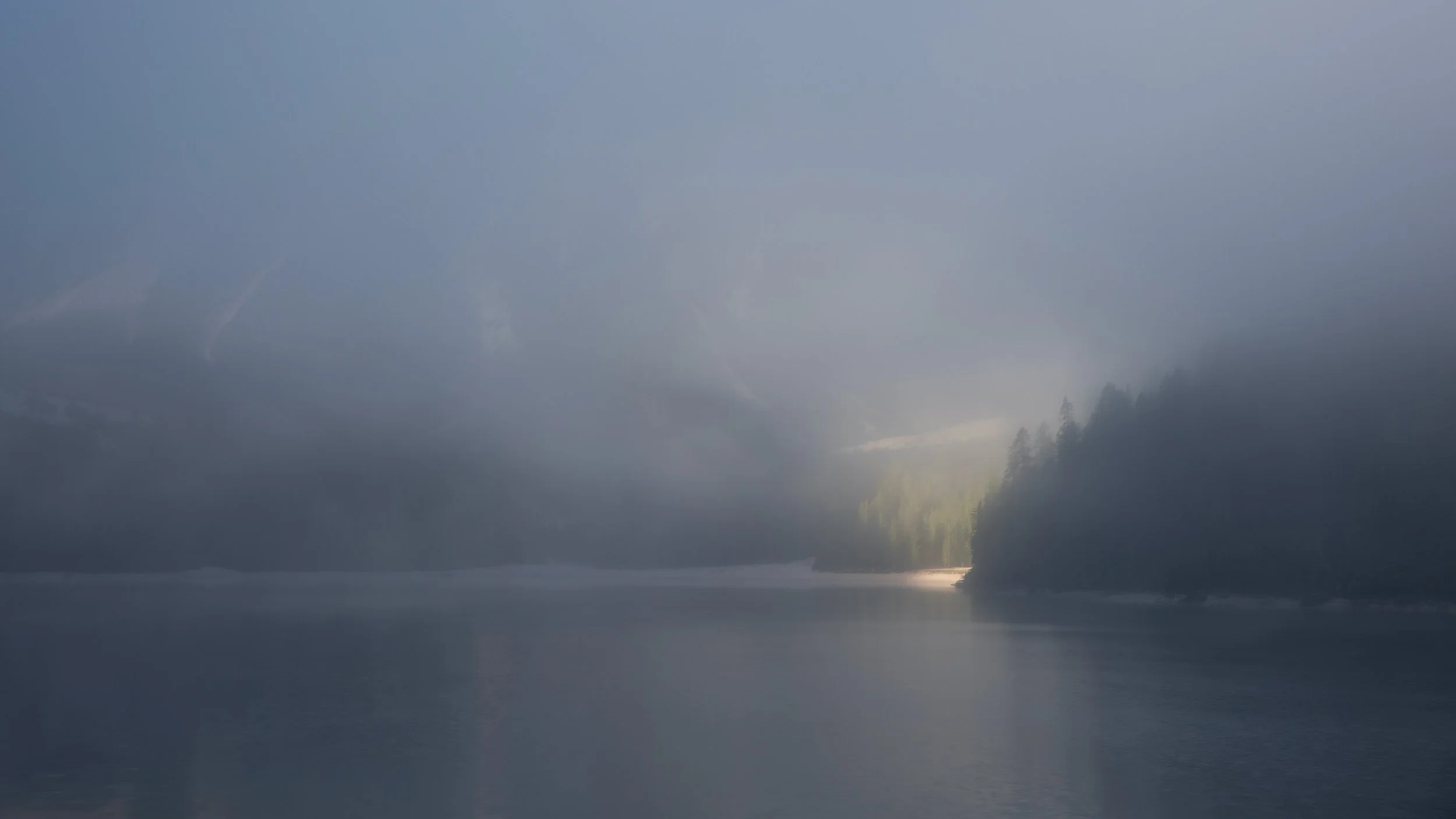 Misty morning at the Lago di braies lake.