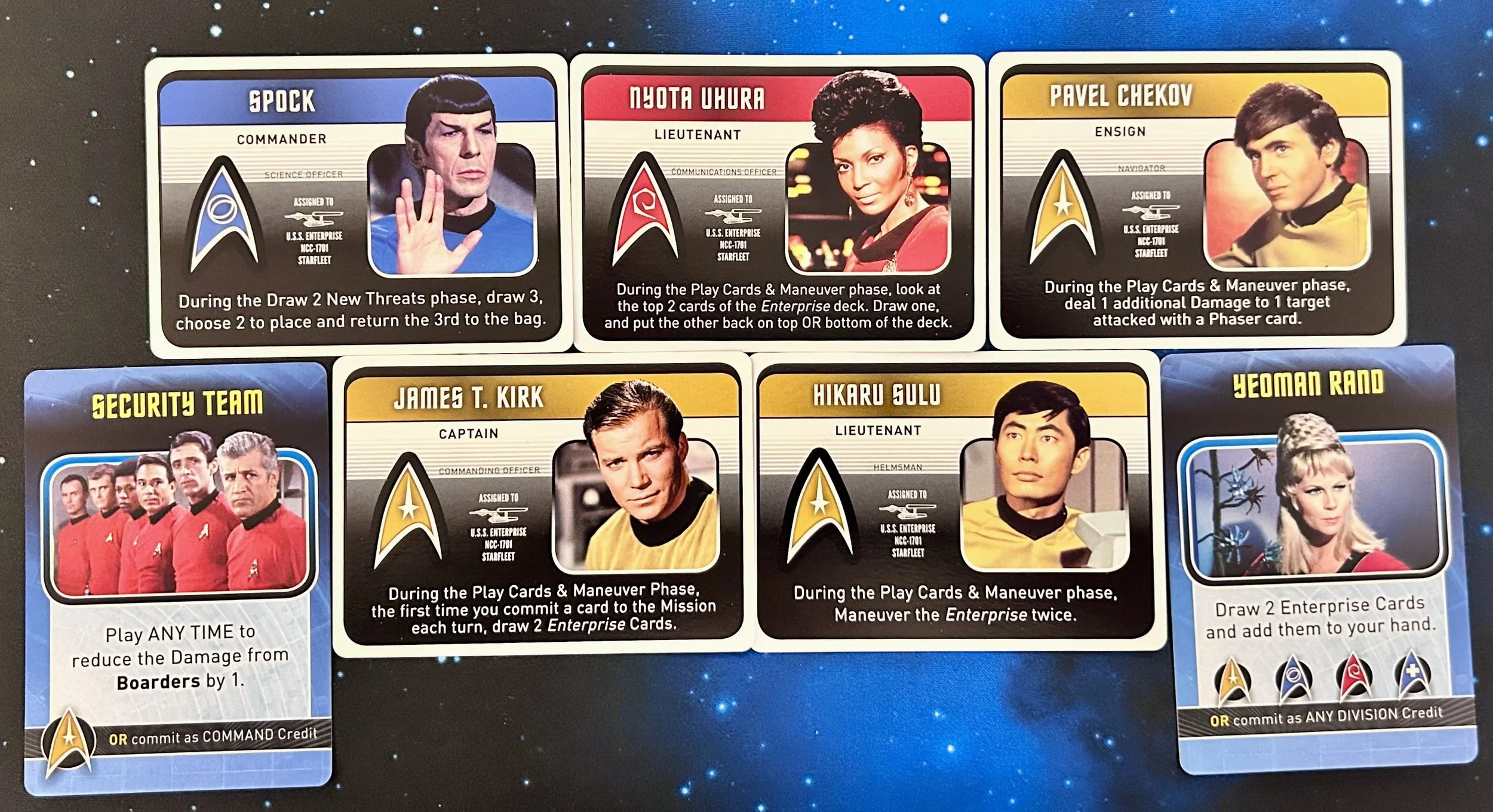 Set of Star Trek trading cards featuring characters from the original series, including Spock, Nyota Uhura, Pavel Chekov, James T. Kirk, Hikaru Sulu, and Yeoman Rand, with instructions on gameplay phases and special abilities.
