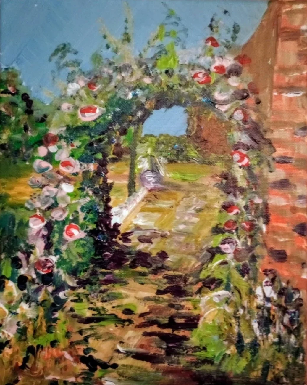 Impressionist painting of a garden scene, featuring an archway covered with pink and white flowers, with a stone pathway leading through greenery and a brick wall on the right, under a blue sky.