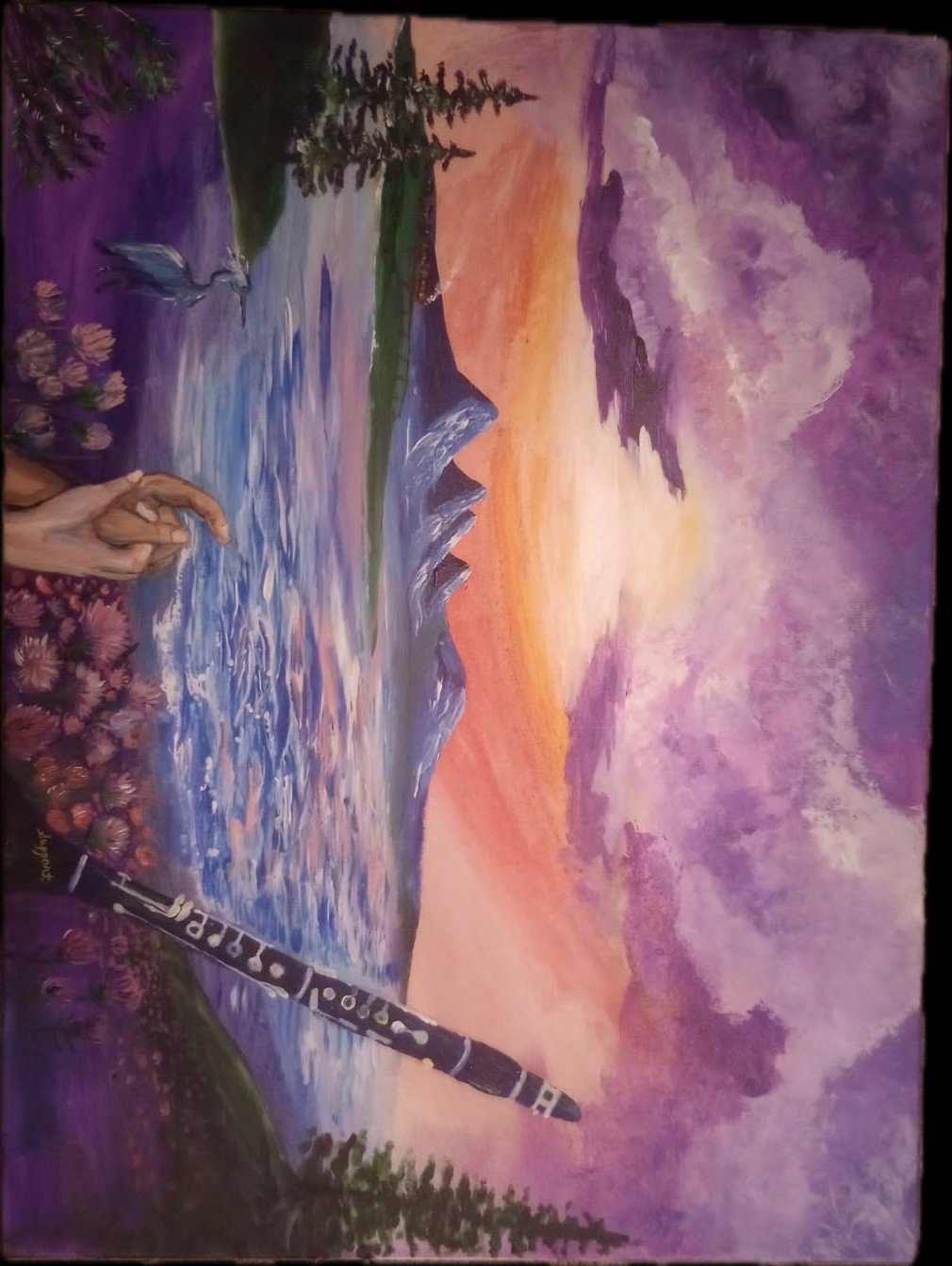 A landscape painting depicting a sunrise or sunset over mountains, with purple and pink clouds, a flowing river, and a hand holding a paintbrush in the foreground. There is also a heron flying above the river and a line of trees and flowers along the riverbank.