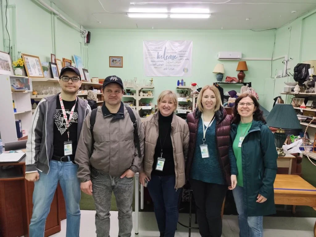 Volunteers smile at Nova Horizons.