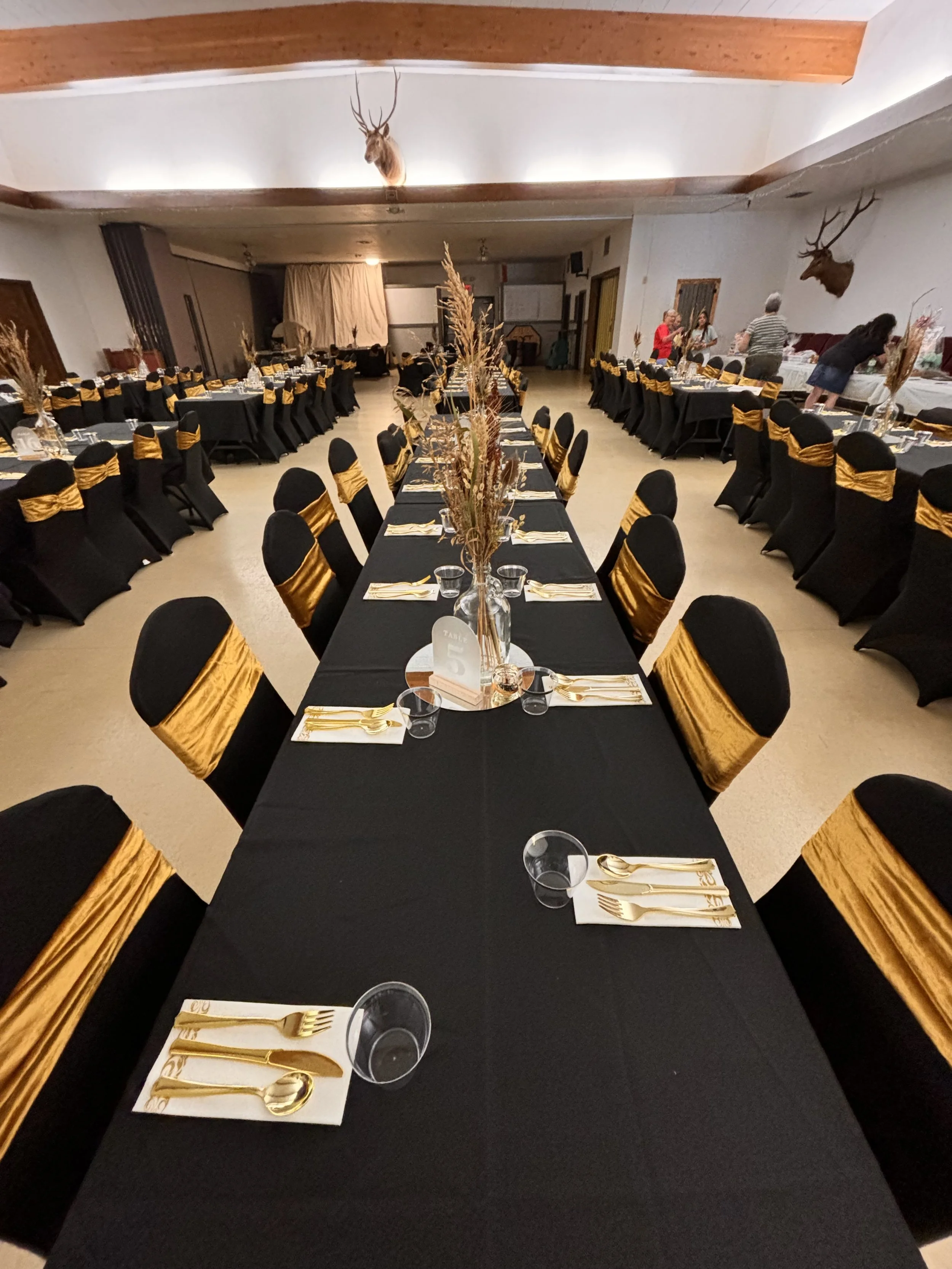 Black chair covers and gold saches
