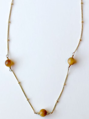 Gold necklace with four large amber beads
