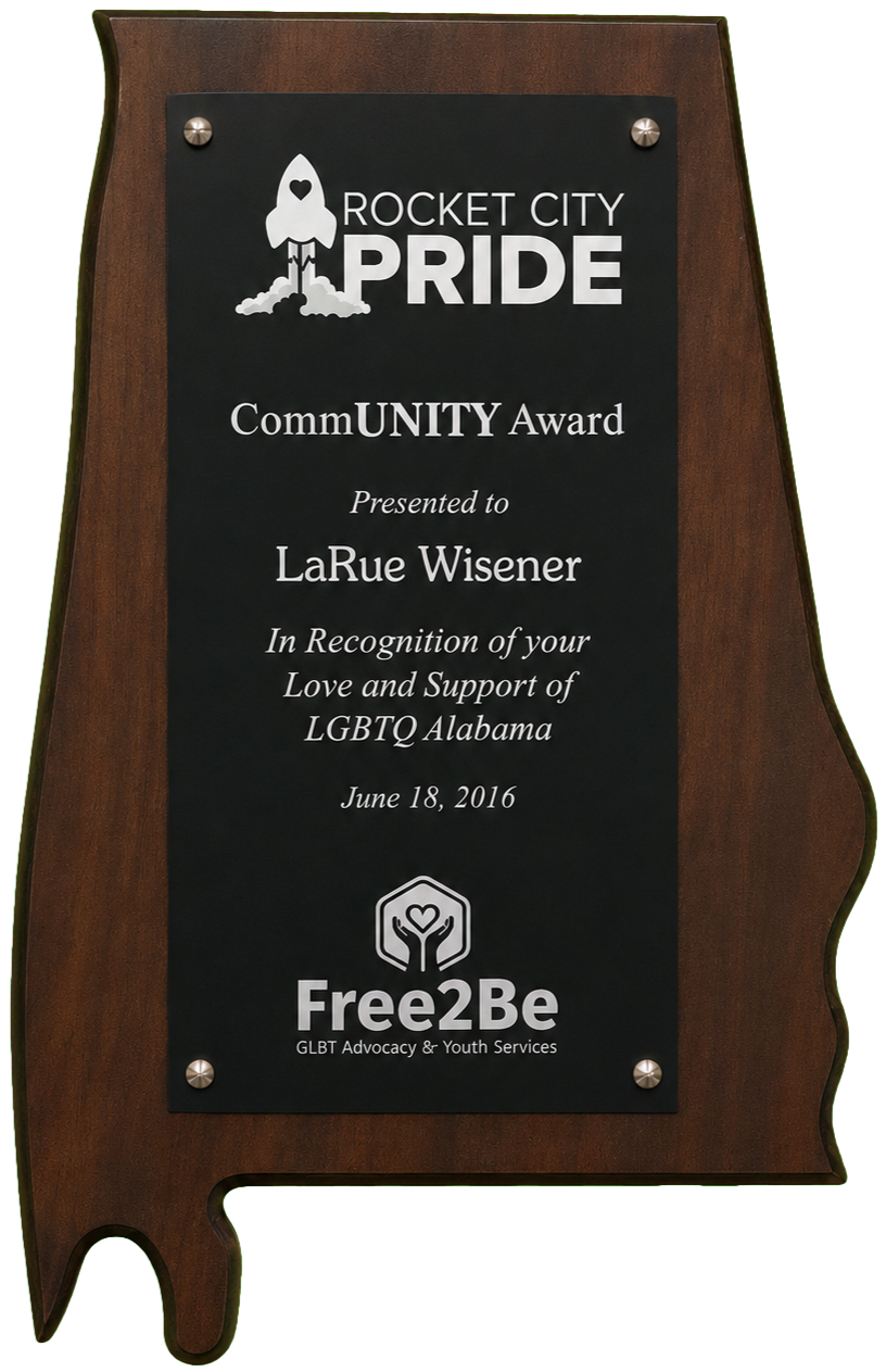 Wooden Rocket City Pride Community Award plaque presented to LaRue Wisener by Free2Be in recognition of support for LGBTQ Alabama, dated June 18, 2016.