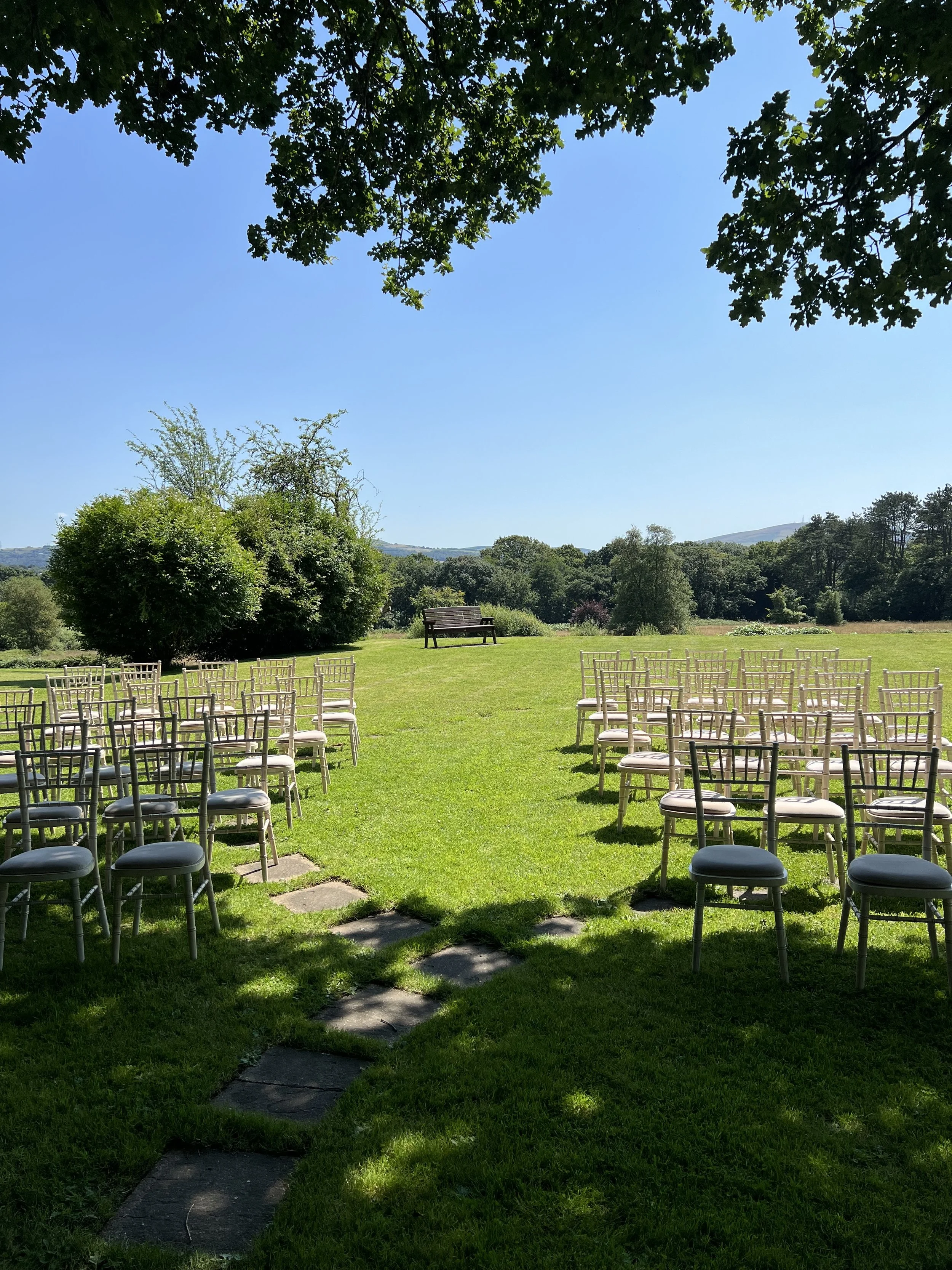 Outdoor wedding ceremony set up at The Glyn Clydach Hotel, Neath Port Talbot, South Wales