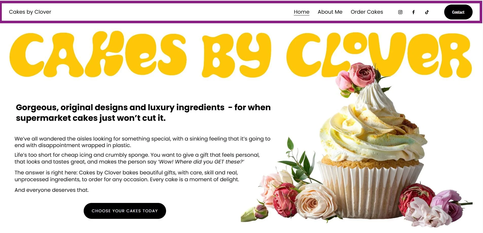 A website homepage for Cakes by Clover featuring a large cupcake with white frosting, pink roses, and other flowers on a white background. The header has the business name in bold, yellow, 70s-style font, and a navigation menu with links to Home, About Me, Order Cakes, and social media icons. There is a black Contact button in the top right corner and a black button labeled 'Choose Your Cakes Today' below the text on the left.