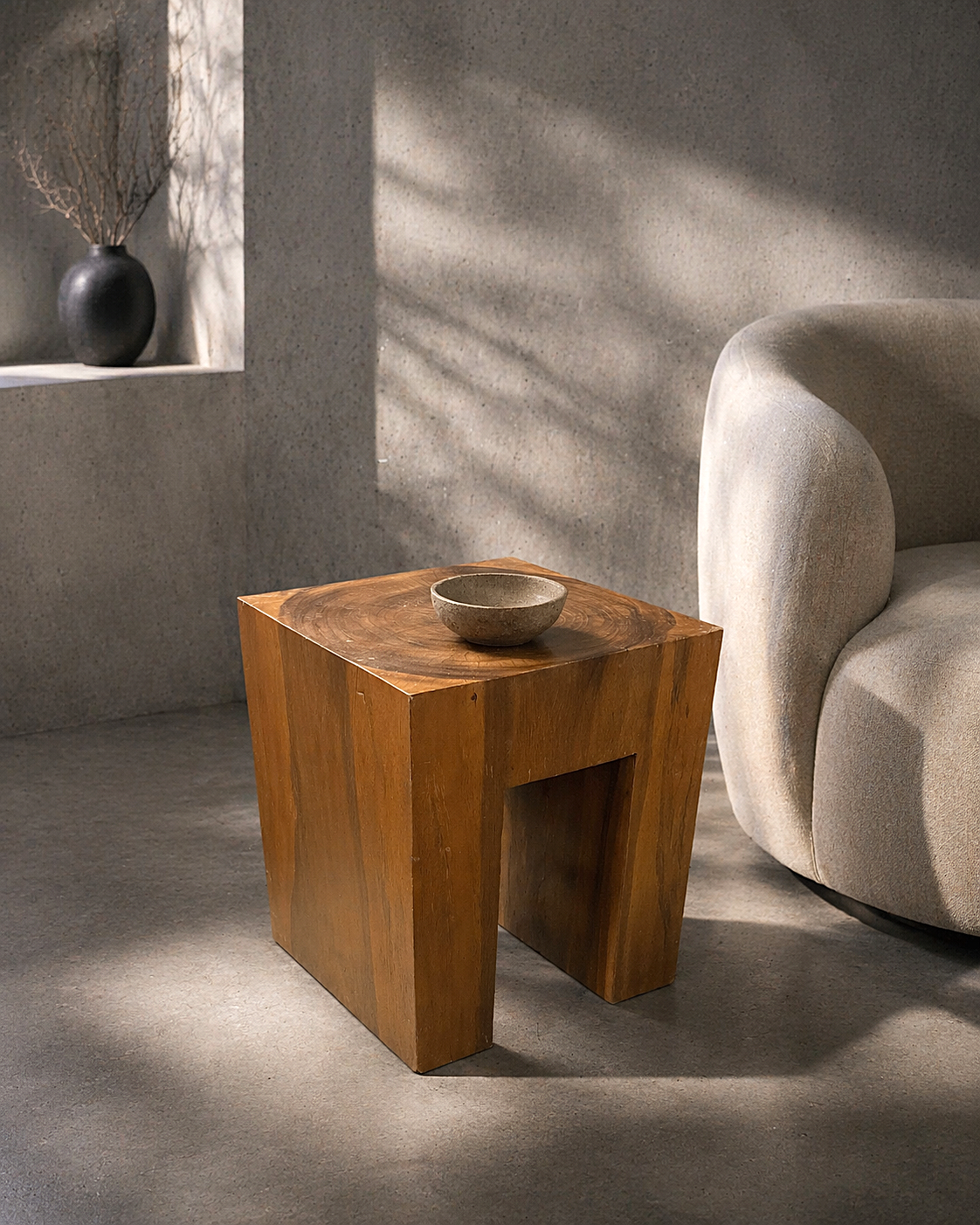 “Organic modern block wood accent table made from reclaimed tropical hardwood, shown in a minimalist interior with soft natural light.”