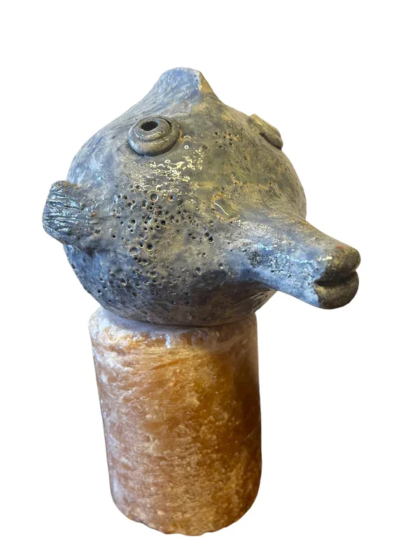 hand made one-of-a-kind puffer fish on a stone base sculpture.webp