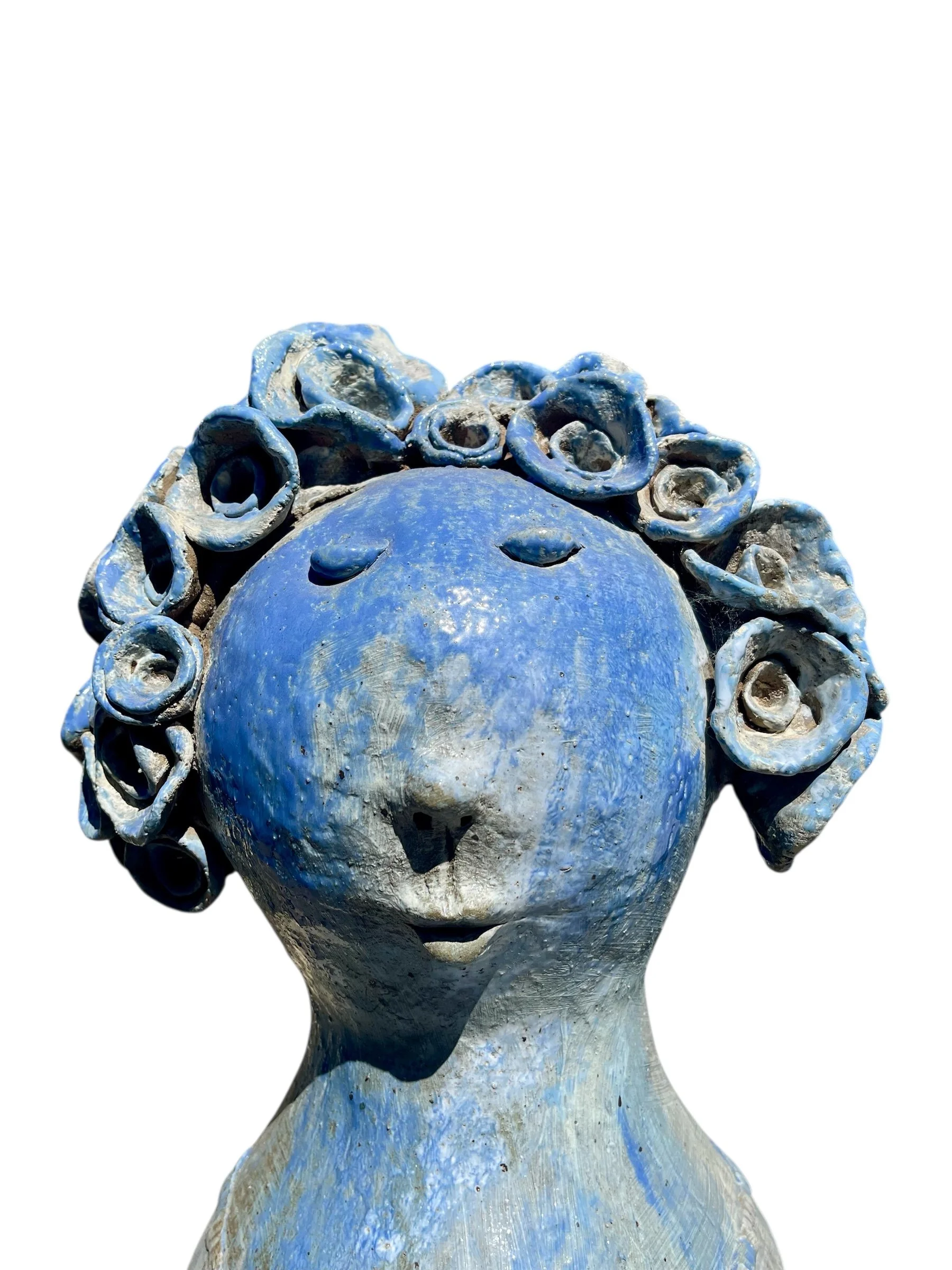 Blue glazed hand sculptured ceramic.