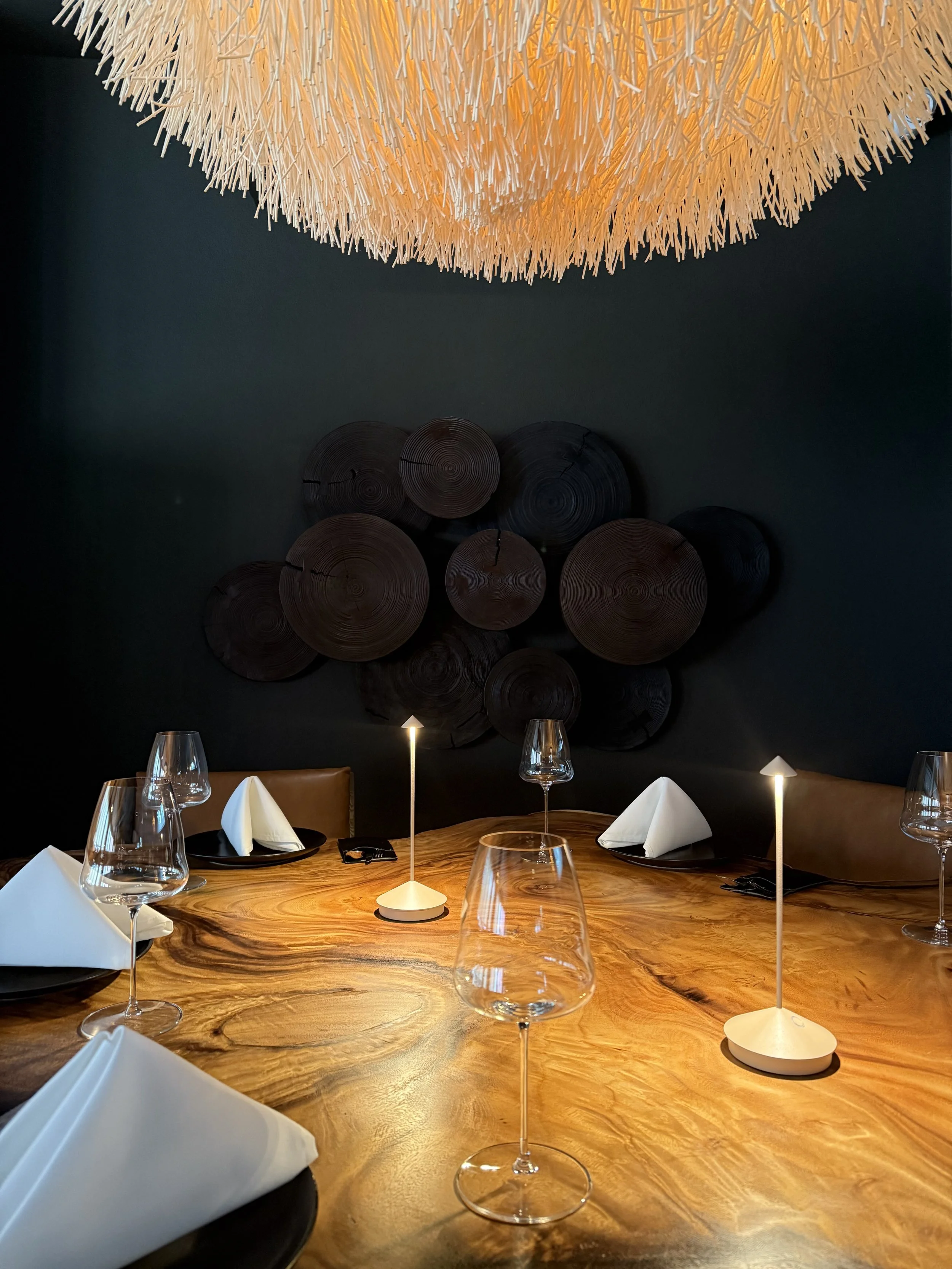 natural wood table and urchin pendant.jpg