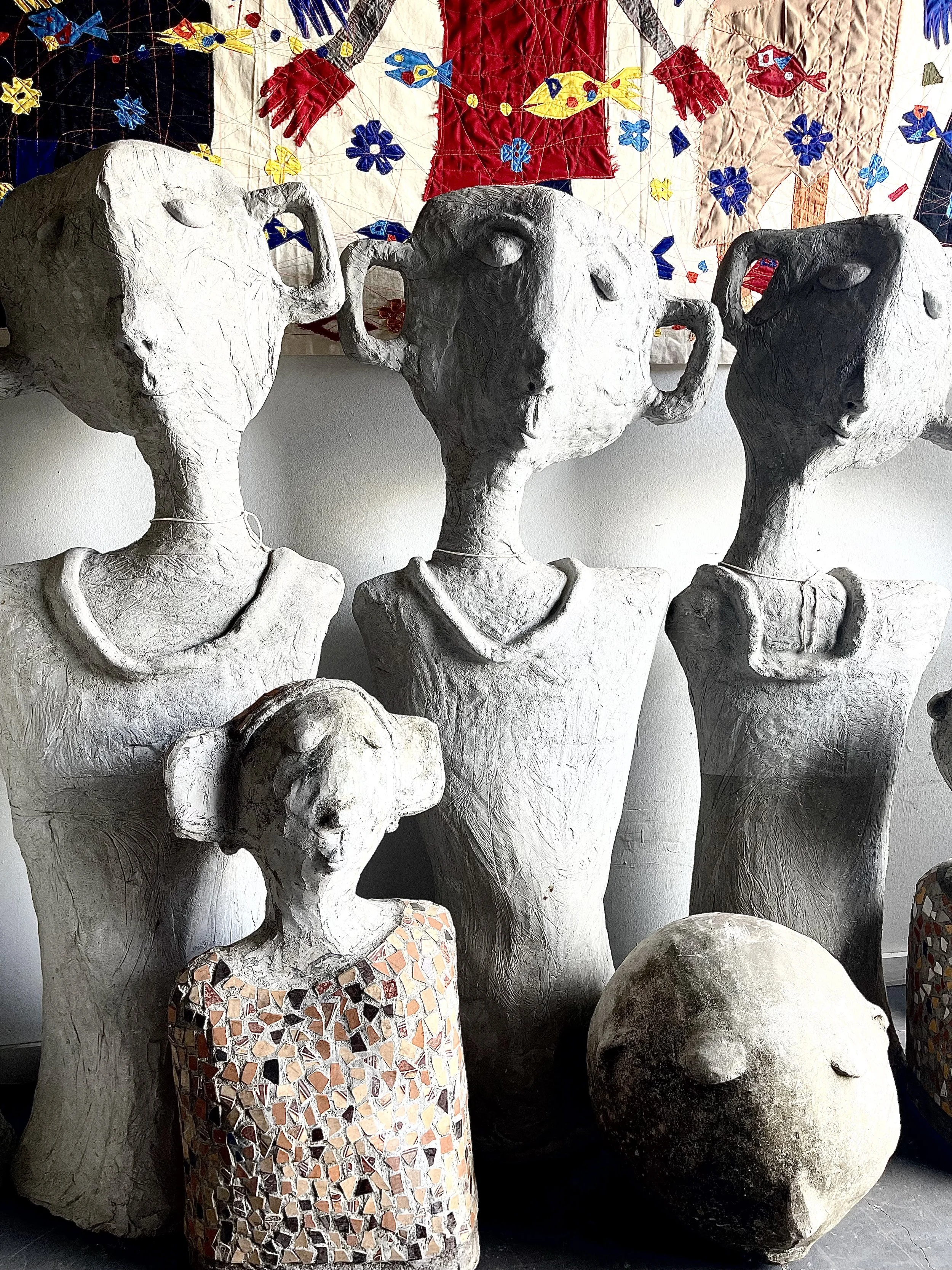 cement full size garden or yard humanoid sculptures each with an individual personality