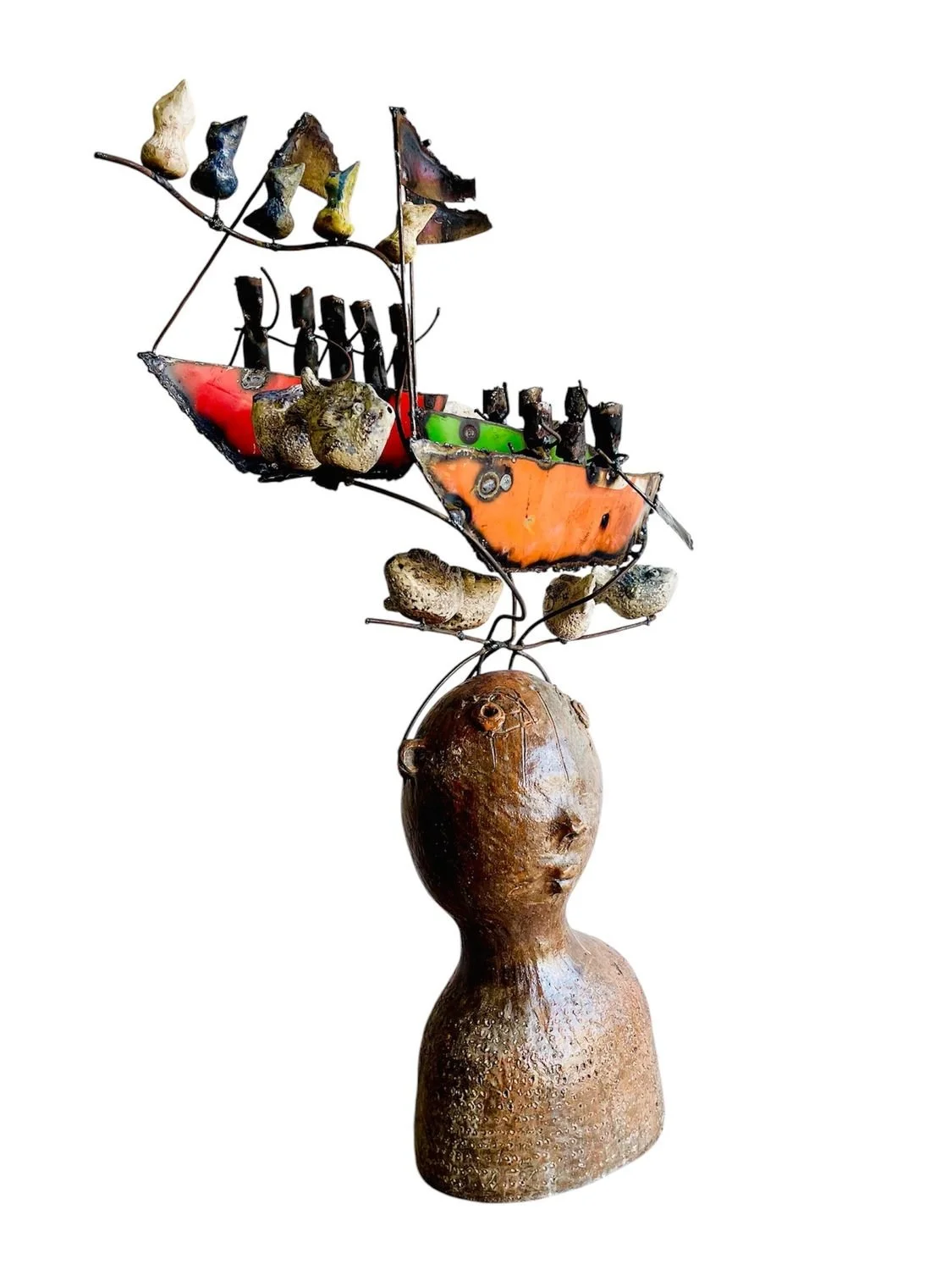 unique ceramic humanoid with boats and birds.jpg