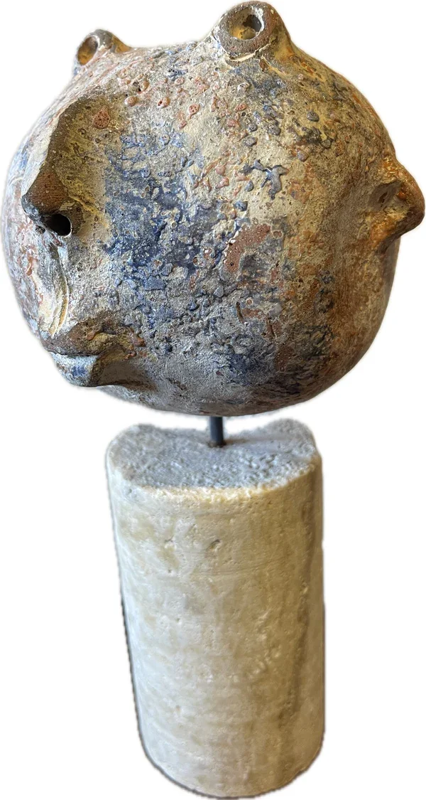 charming ceramic head on a stone pedestal hs9241.webp