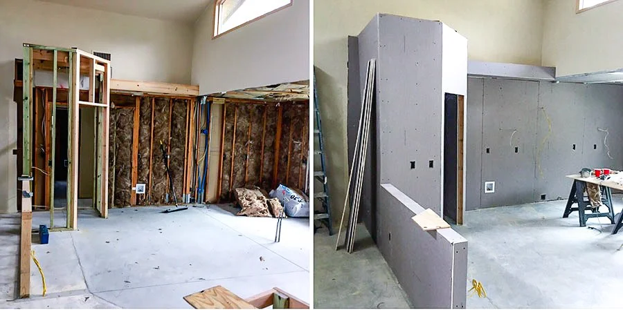 Interior of a home under renovation with exposed wall studs on the left and drywall installation on the right.