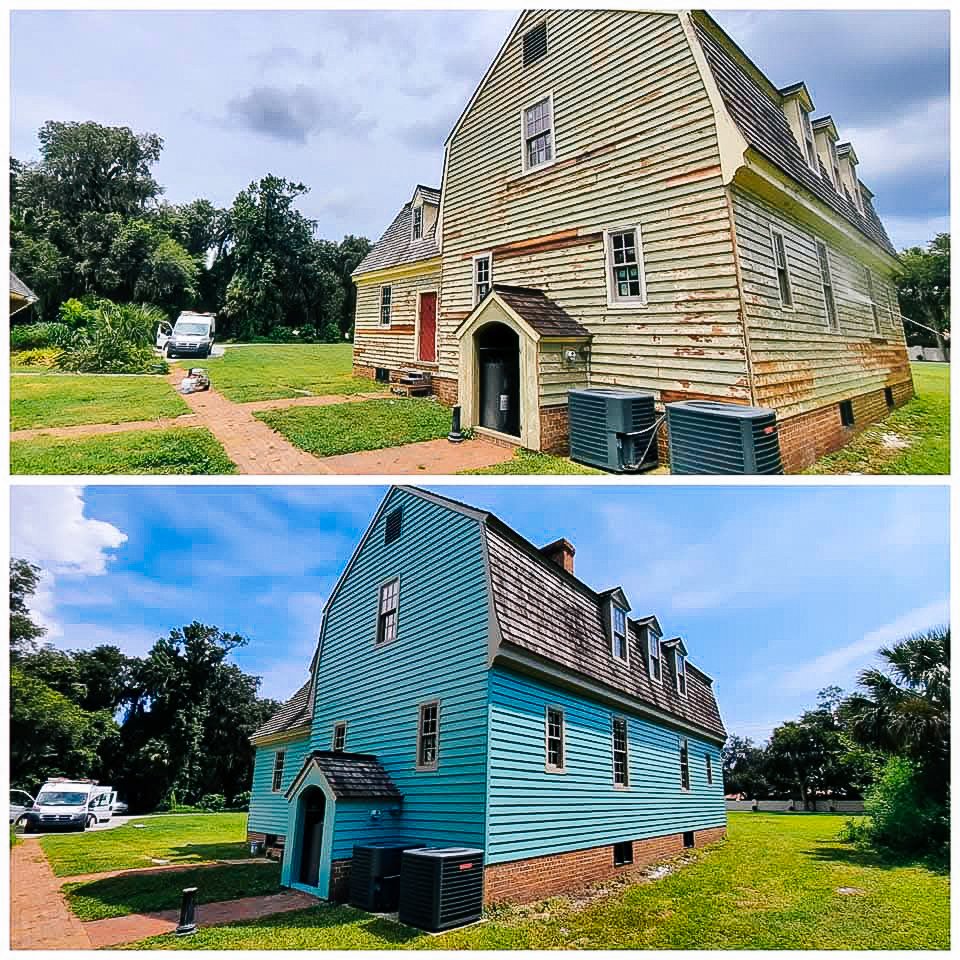 Side-by-side comparison of a two-story house with different exterior paint colors, showing the house before and after a paint renovation, with a grassy yard, brick pathway, and trees in the background.
