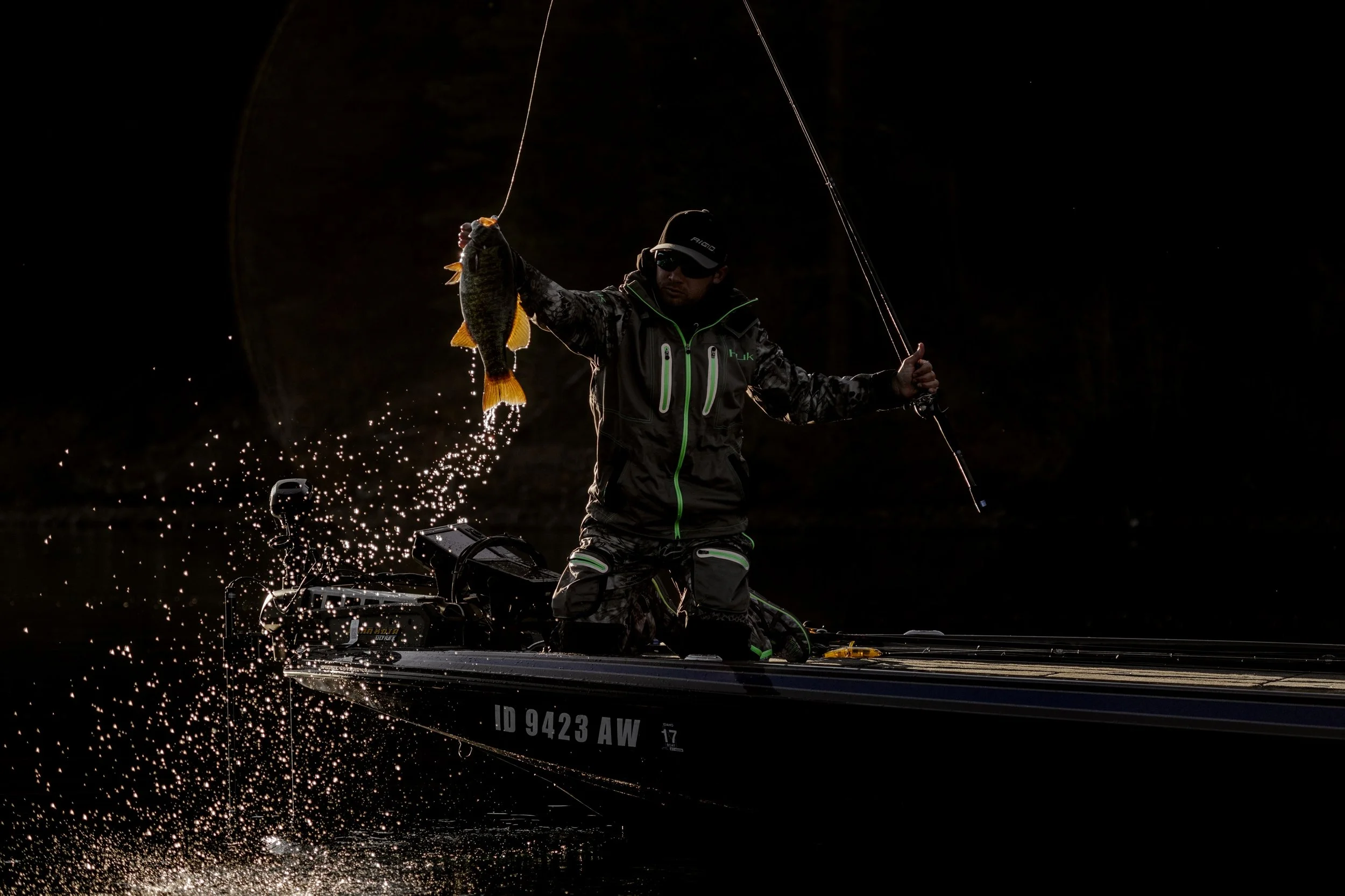 Man on a fishing boat wearing Huk apparel