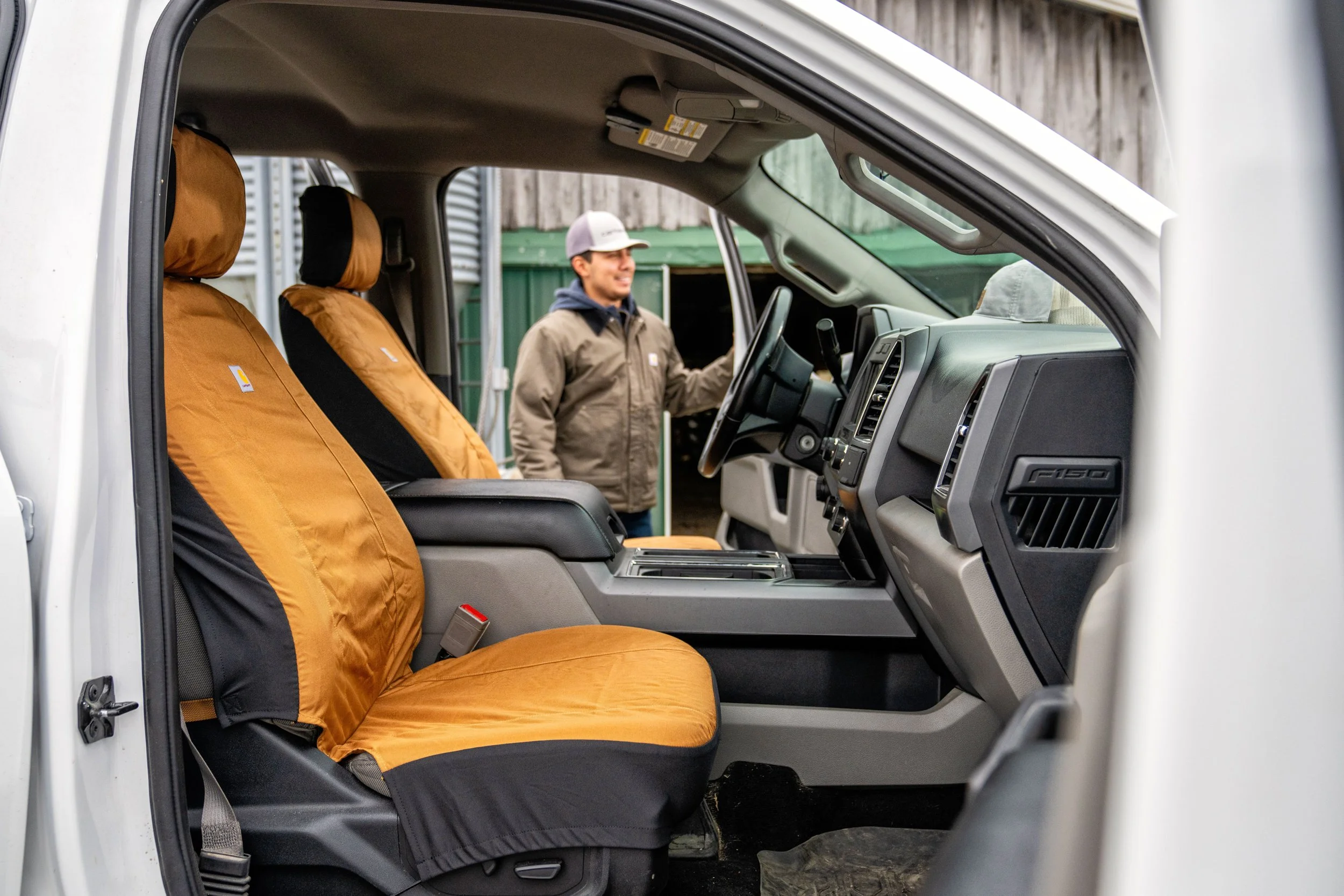 The interior of a truck with Carhartt seat covers