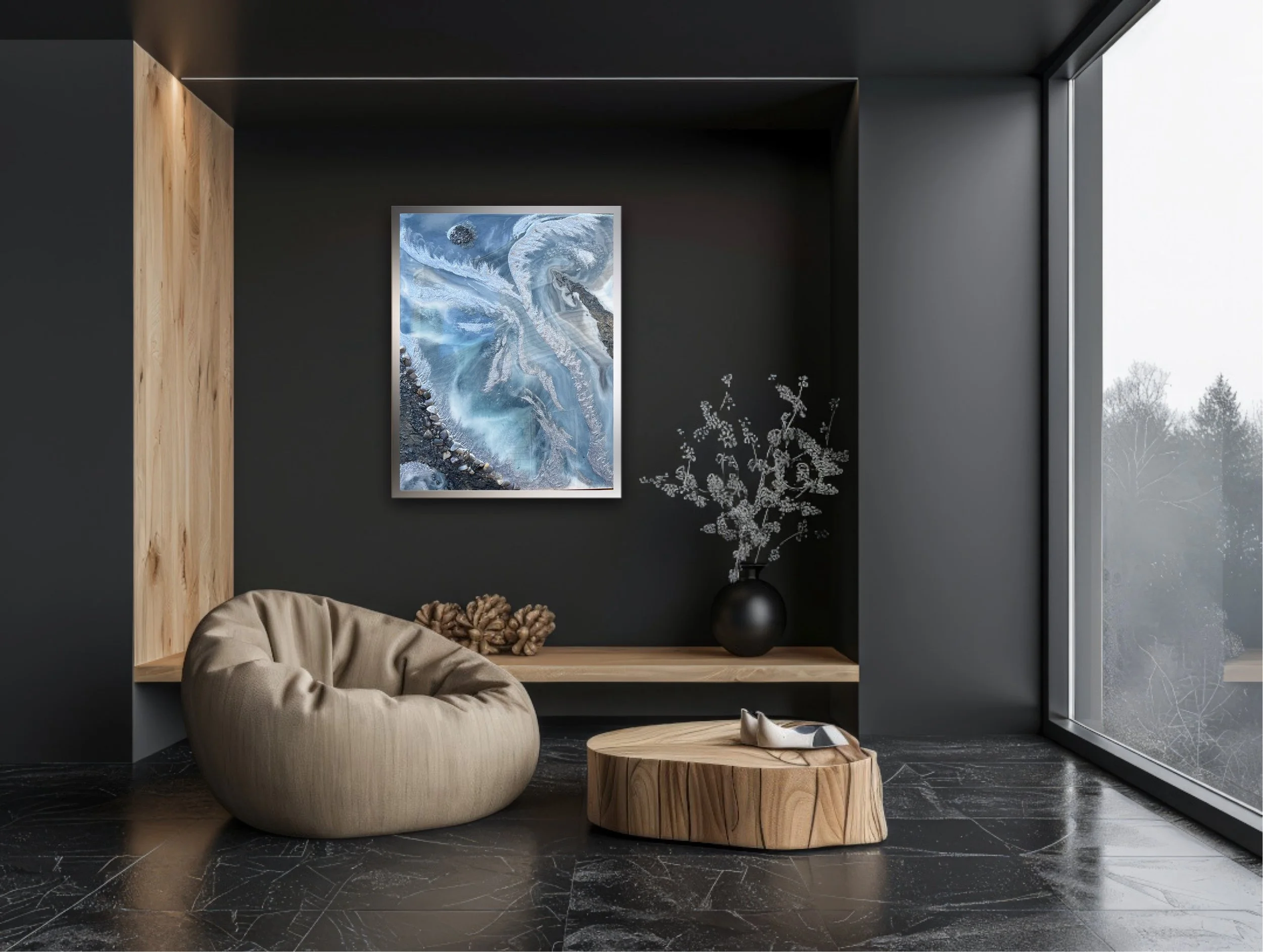 Modern living room corner with black walls, a beige bean bag chair, a natural wooden coffee table, abstract Tatyana Y. Kravchenko's artwork on the wall, a black vase with white flowers, and a large window showing a winter landscape.