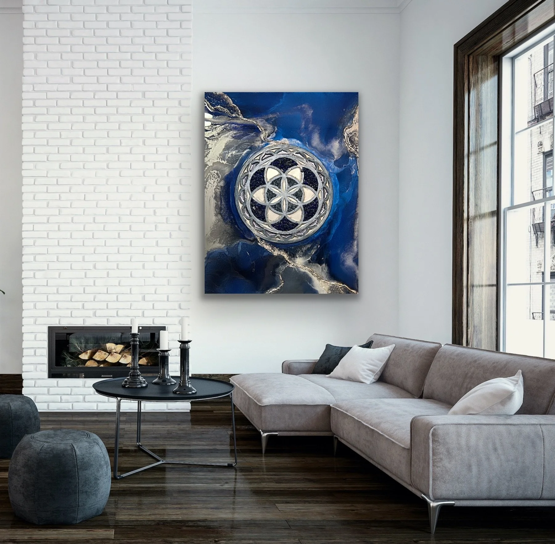 Modern living room with Tatyana Y. Kravchenko's abstract artwork with blue, black, white, and metallic elements on the wall.
