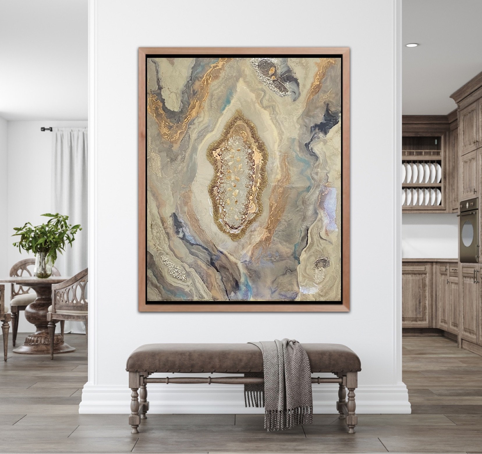 Living room with a large framed abstract Tatyana Y. Kravchenko's wall art on a white wall, with a gray upholstered bench and a gray throw blanket in front.